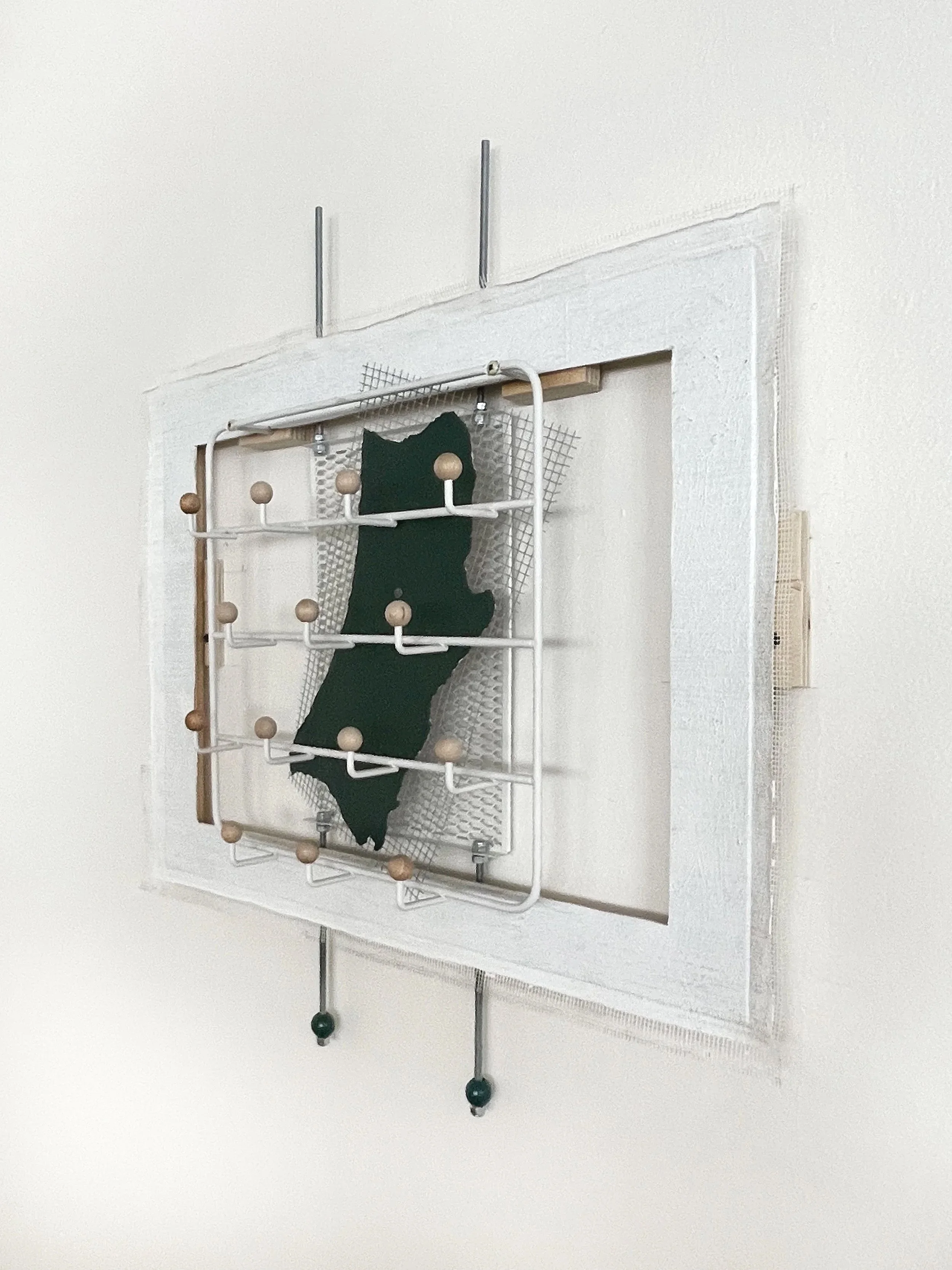 Untitled (french market), 2025-2026, 28h x 26.5w x 5d - salvaged barricade paper from the closed French Market restaurant, Ikea shelving, pre-mounted wood panel, prescription drug legal disclaimers, construction mesh, sheet rock tape, threaded rod, w