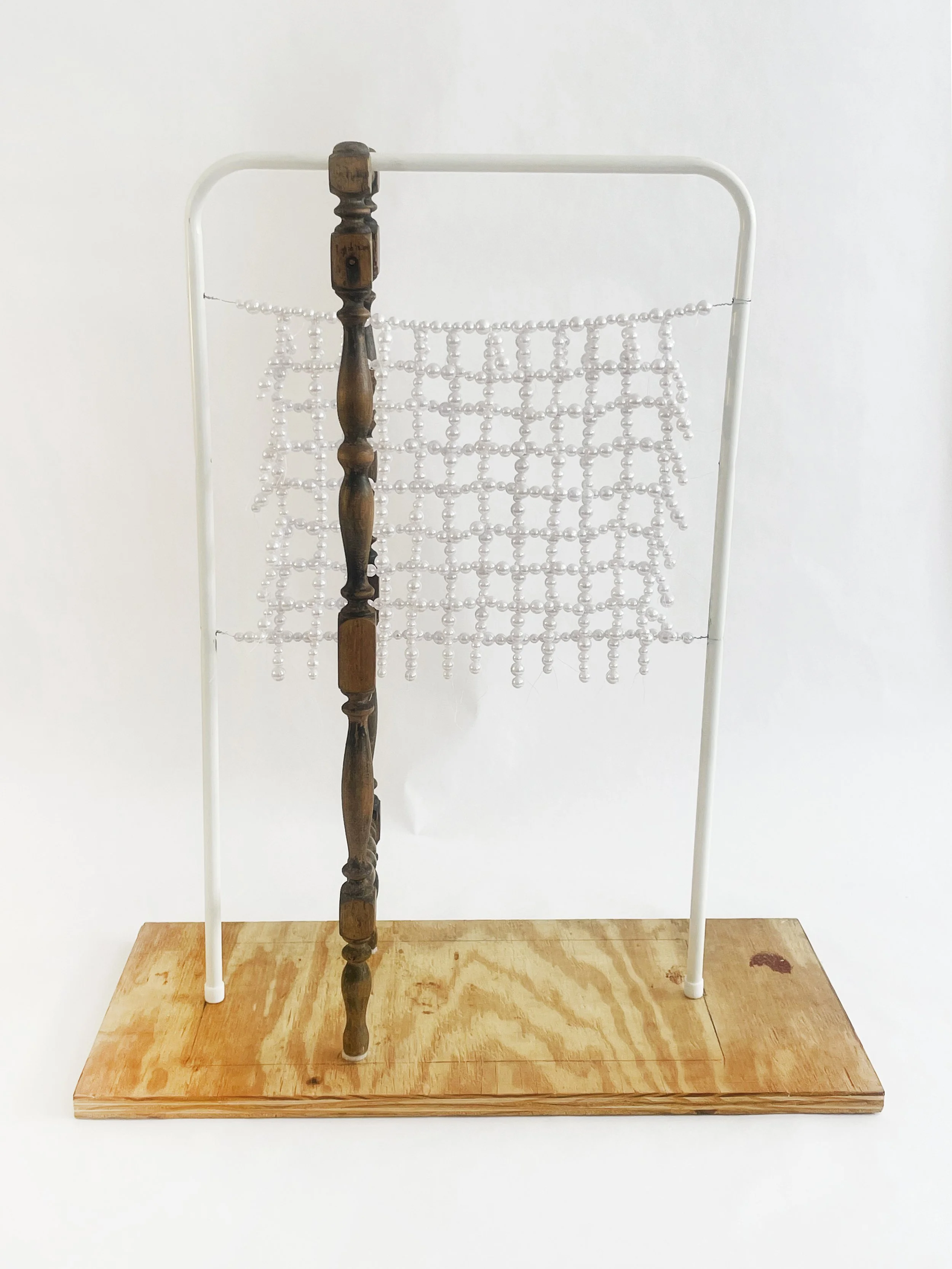 Untitled (radiator), 2026, 28h x 24x x 11d - salvaged turned wood, Ikea aluminum legs, plastic pearl beads, found plywood, wire, thread, thread rod