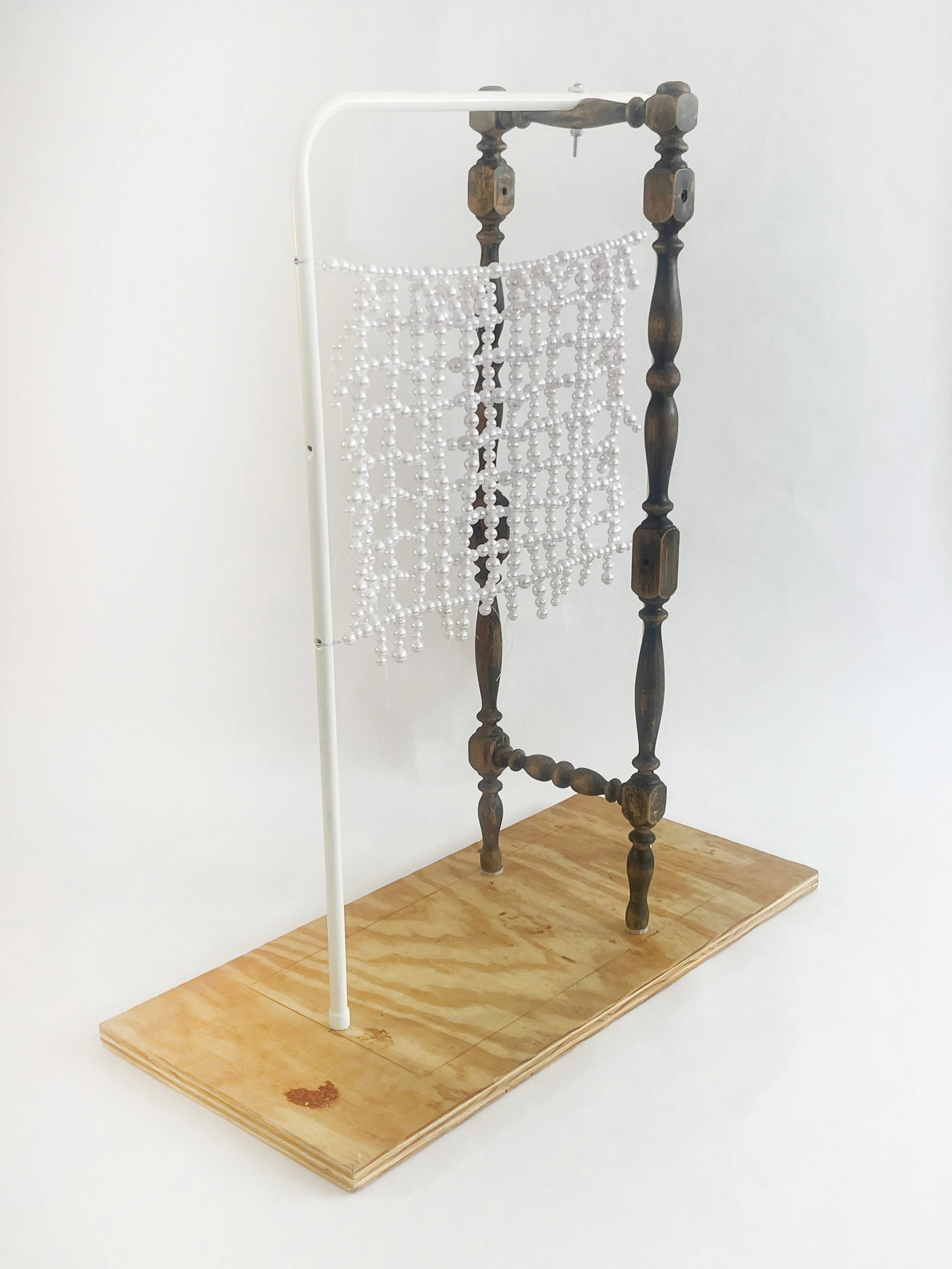 Untitled (radiator), 2026, 28h x 24x x 11d - salvaged turned wood, Ikea aluminum legs, plastic pearl beads, found plywood, wire, thread, thread rod
