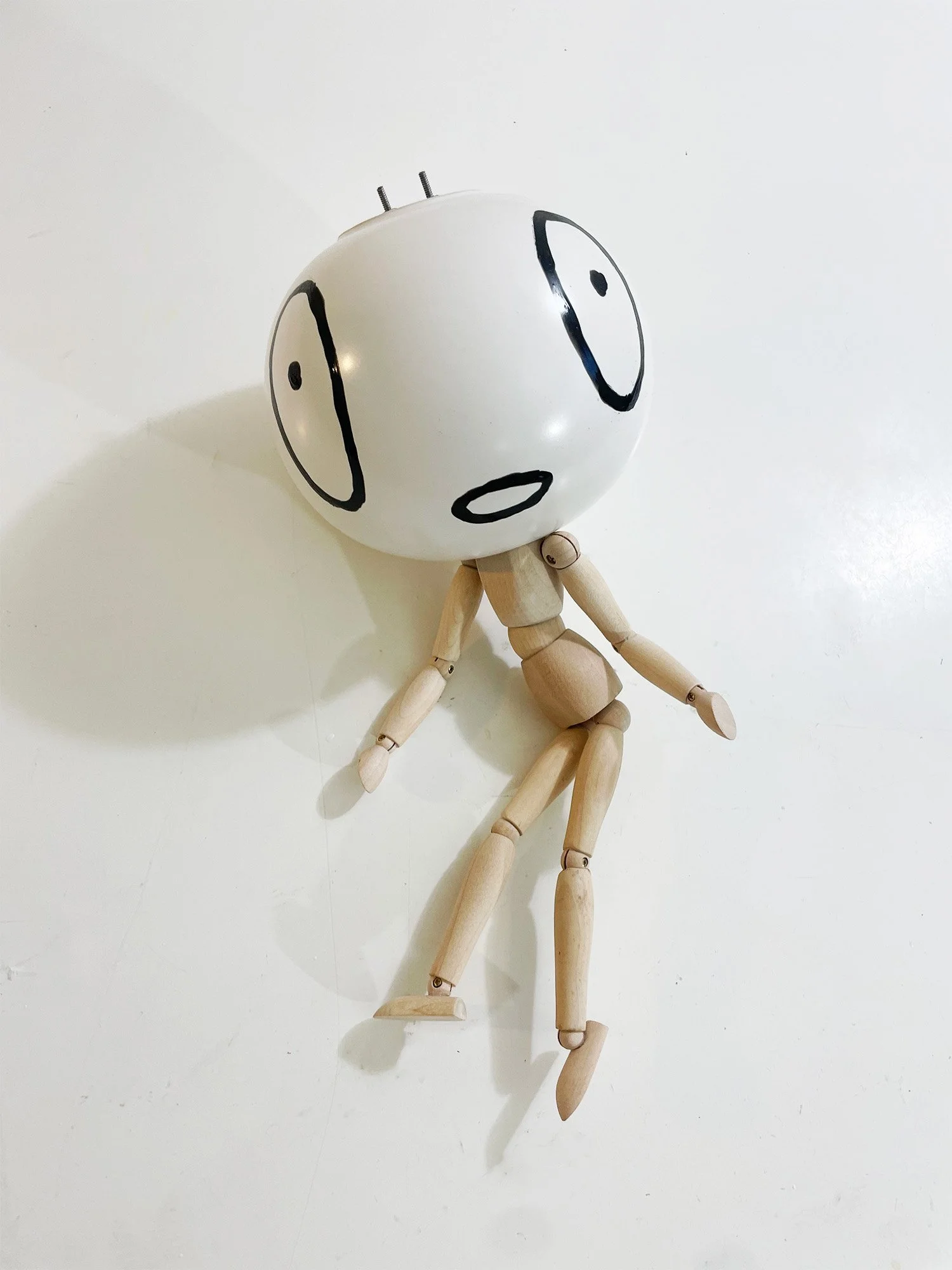Untitled (vase head), 6h x 15w x 6d, adjustable wooden mannequin, round ceramic vase, bake-on paint, threaded rod, nuts, washers, glue, 2026