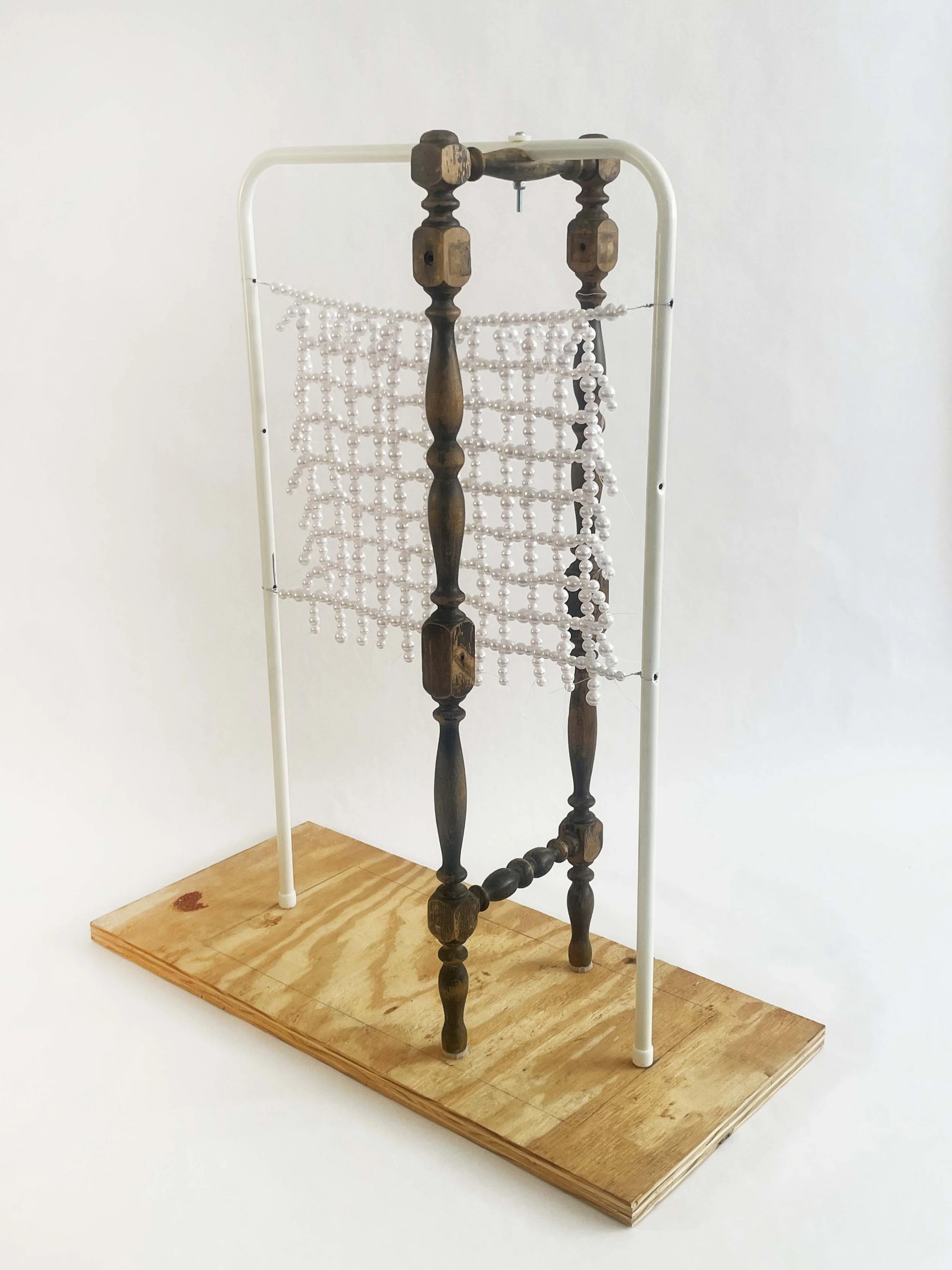 Untitled (radiator), 2026, 28h x 24x x 11d - salvaged turned wood, Ikea aluminum legs, plastic pearl beads, found plywood, wire, thread, thread rod