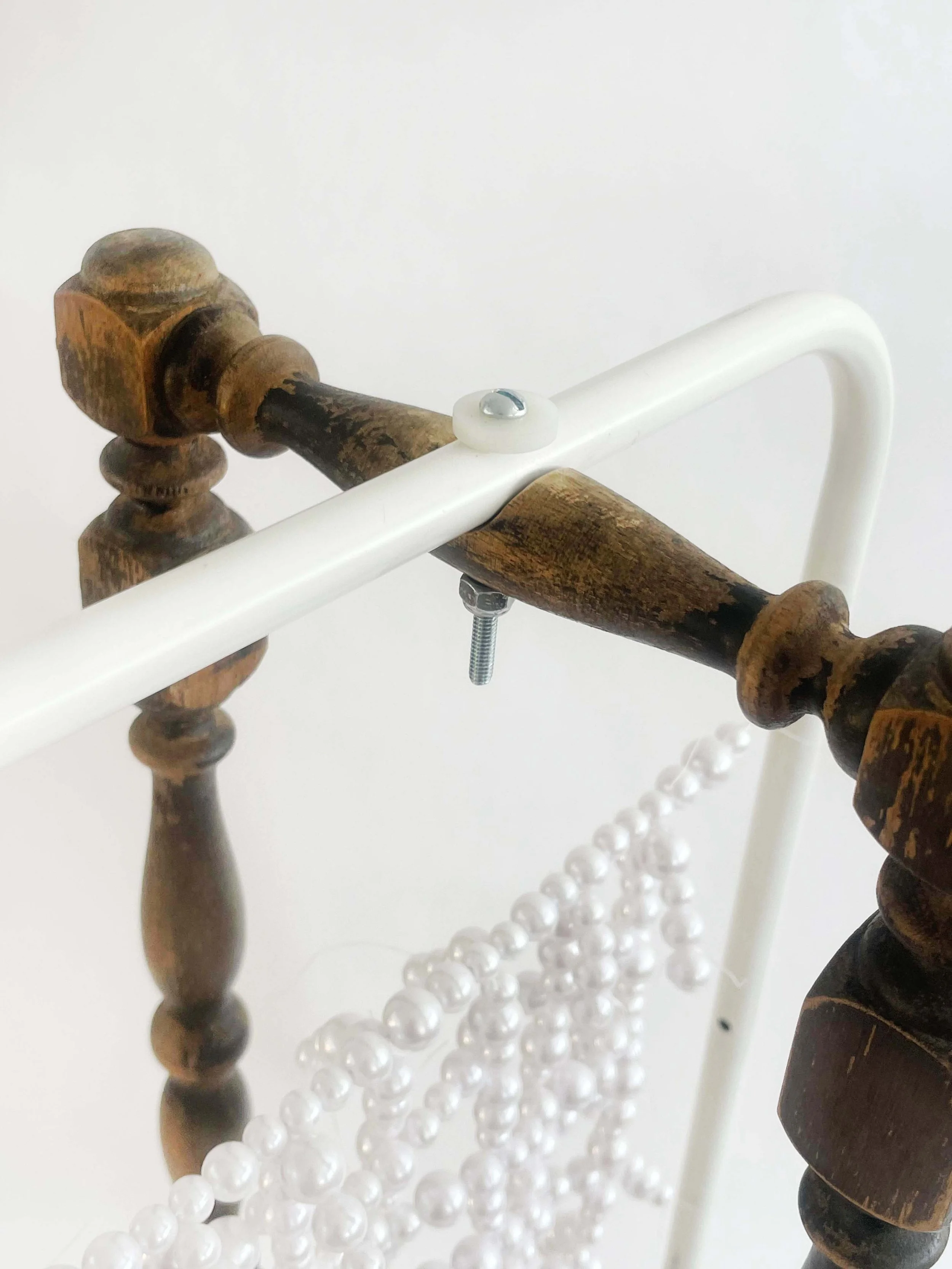 Untitled (radiator), 2026, 28h x 24x x 11d - salvaged turned wood, Ikea aluminum legs, plastic pearl beads, found plywood, wire, thread, thread rod