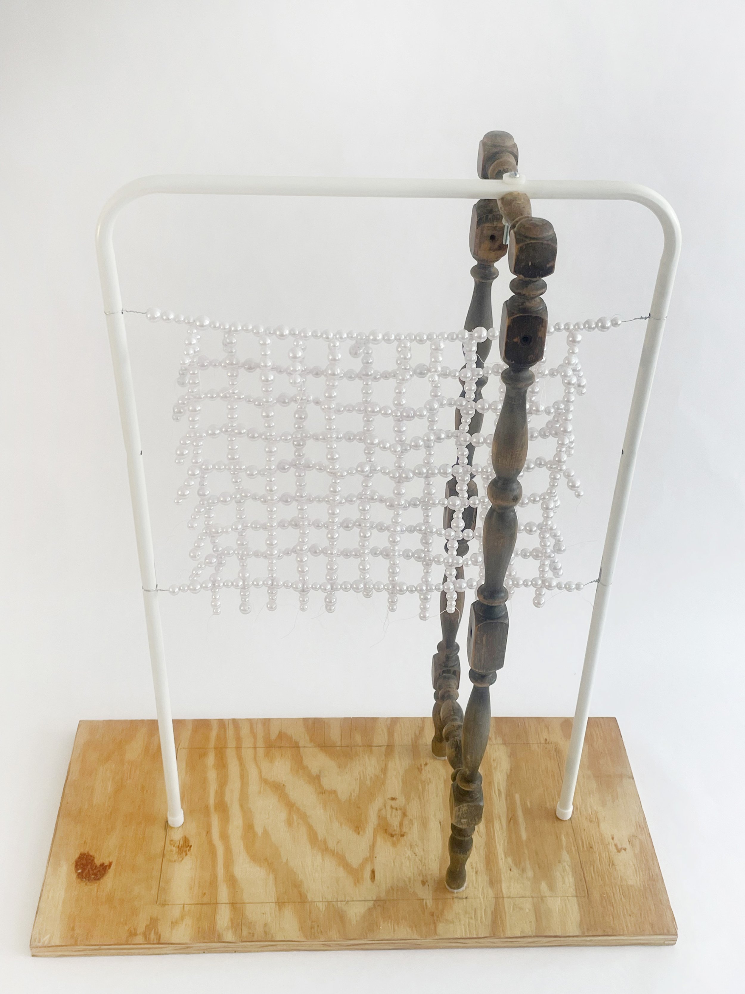 Untitled (radiator), 2026, 28h x 24x x 11d - salvaged turned wood, Ikea aluminum legs, plastic pearl beads, found plywood, wire, thread, thread rod