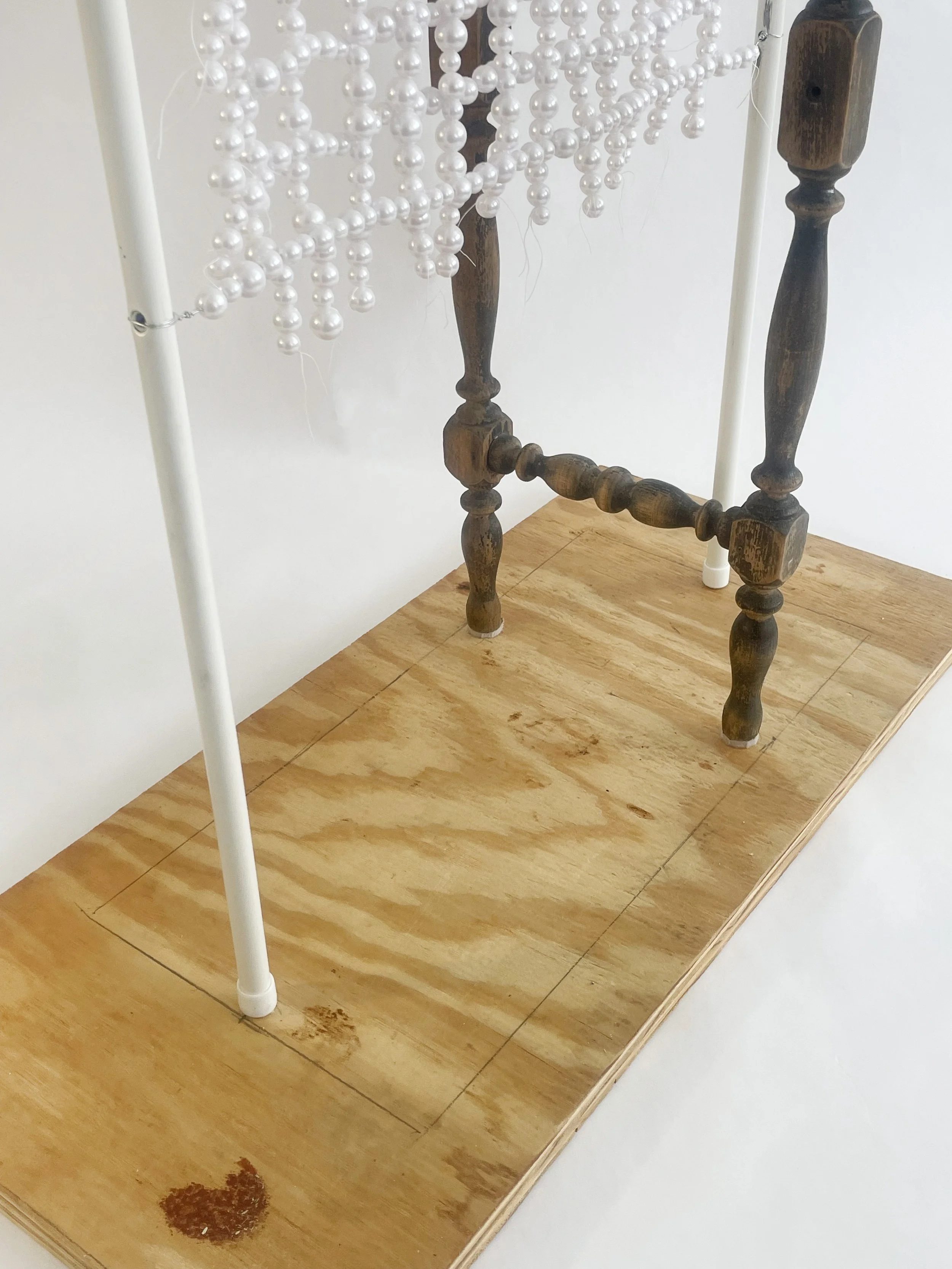 Untitled (radiator), 2026, 28h x 24x x 11d - salvaged turned wood, Ikea aluminum legs, plastic pearl beads, found plywood, wire, thread, thread rod