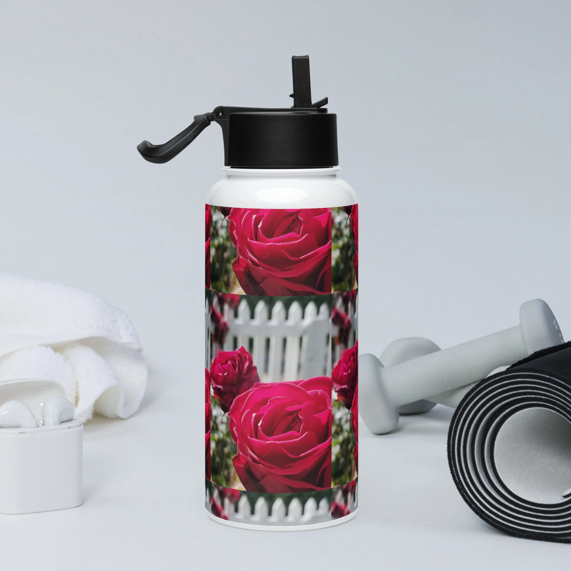 Stainless steel water bottle with a straw lid