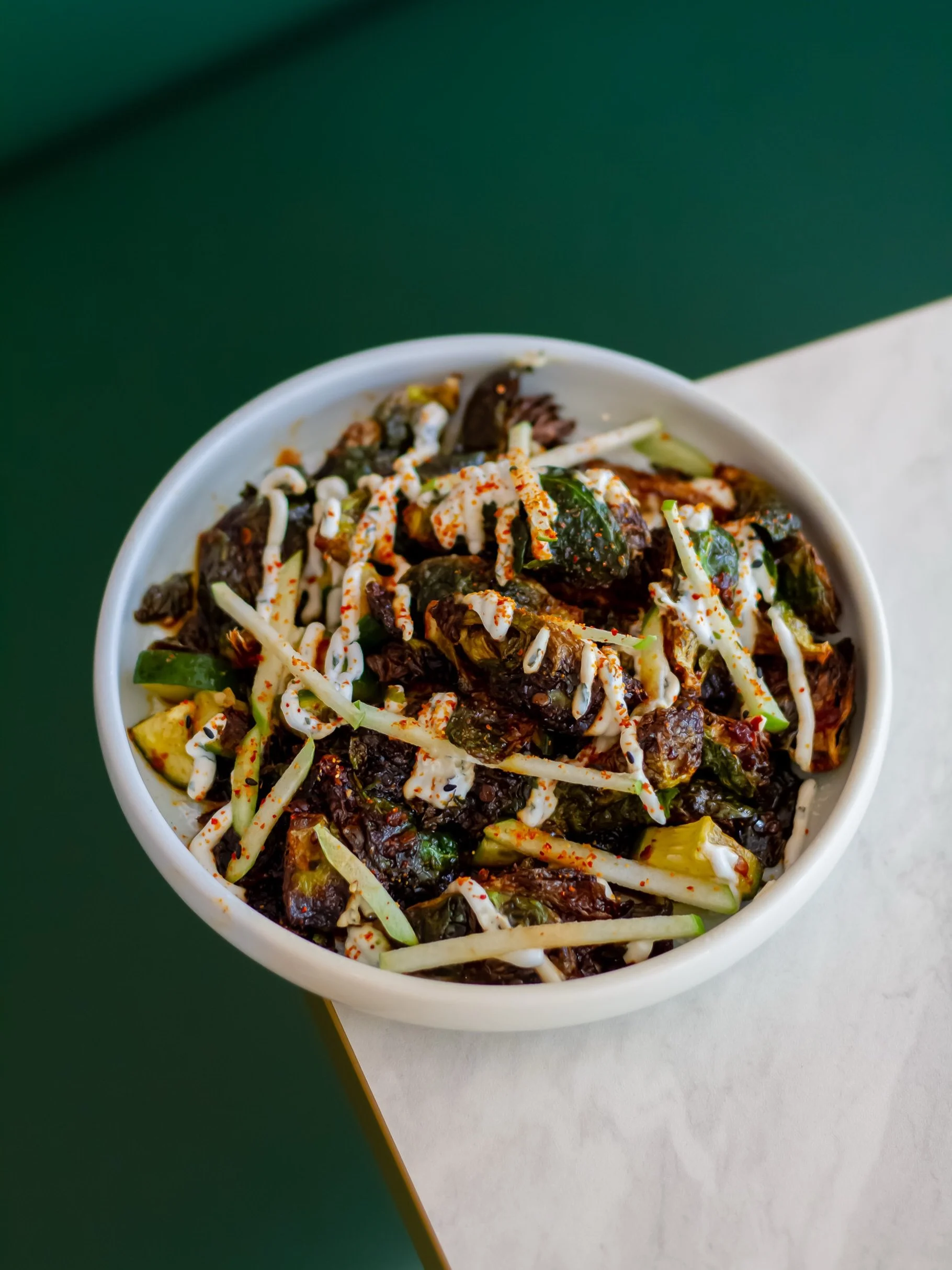 Think you don&rsquo;t like Brussels sprouts? This dish might just change your mind.

Charred, crisp and finished with sambal, cooling yoghurt, cucumber, apple and a touch of chilli for the perfect balance of heat and freshness.