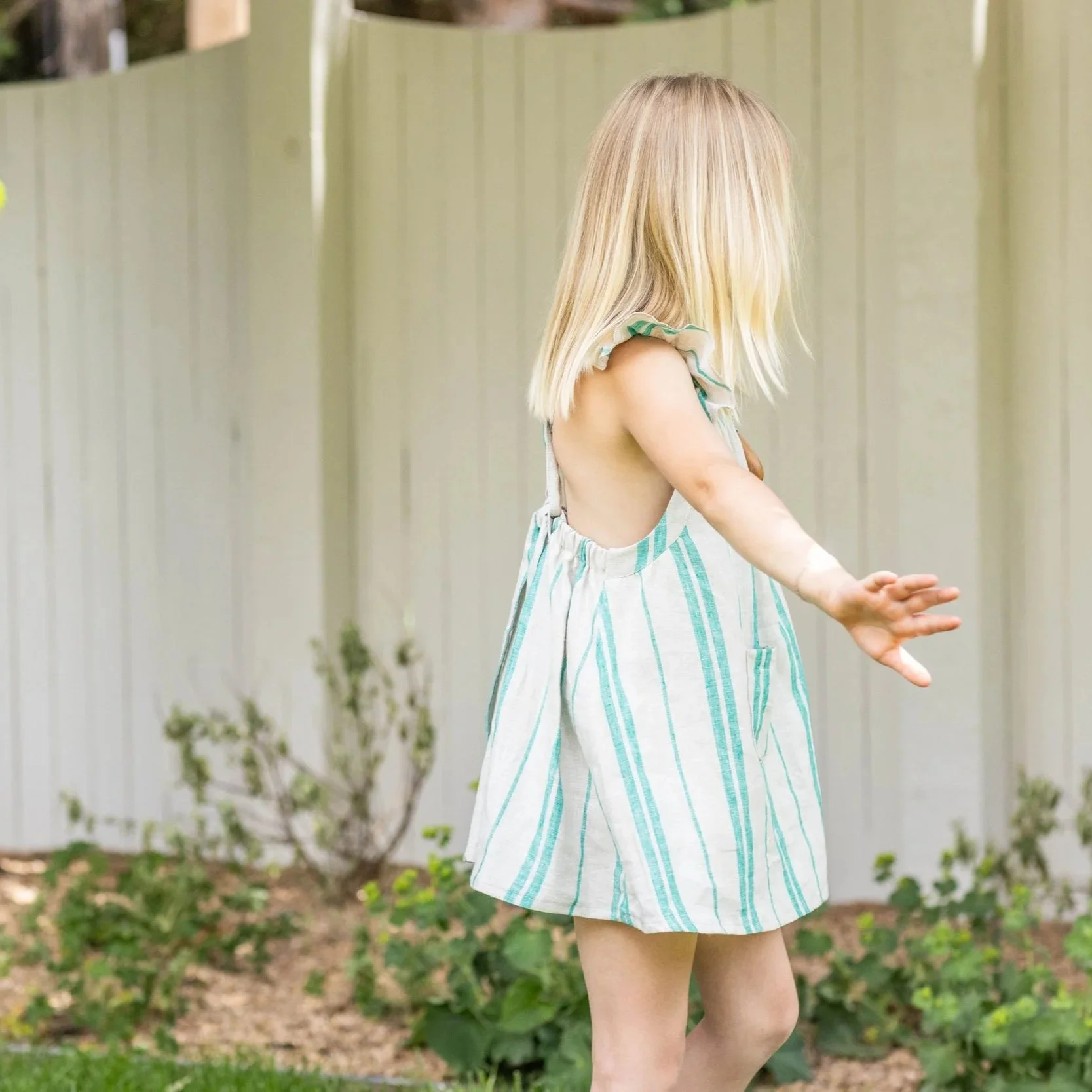 Foxlilie-girl-ivy-ruffle-dress-jade-stripe-lifestyle-backside-detail.jpg