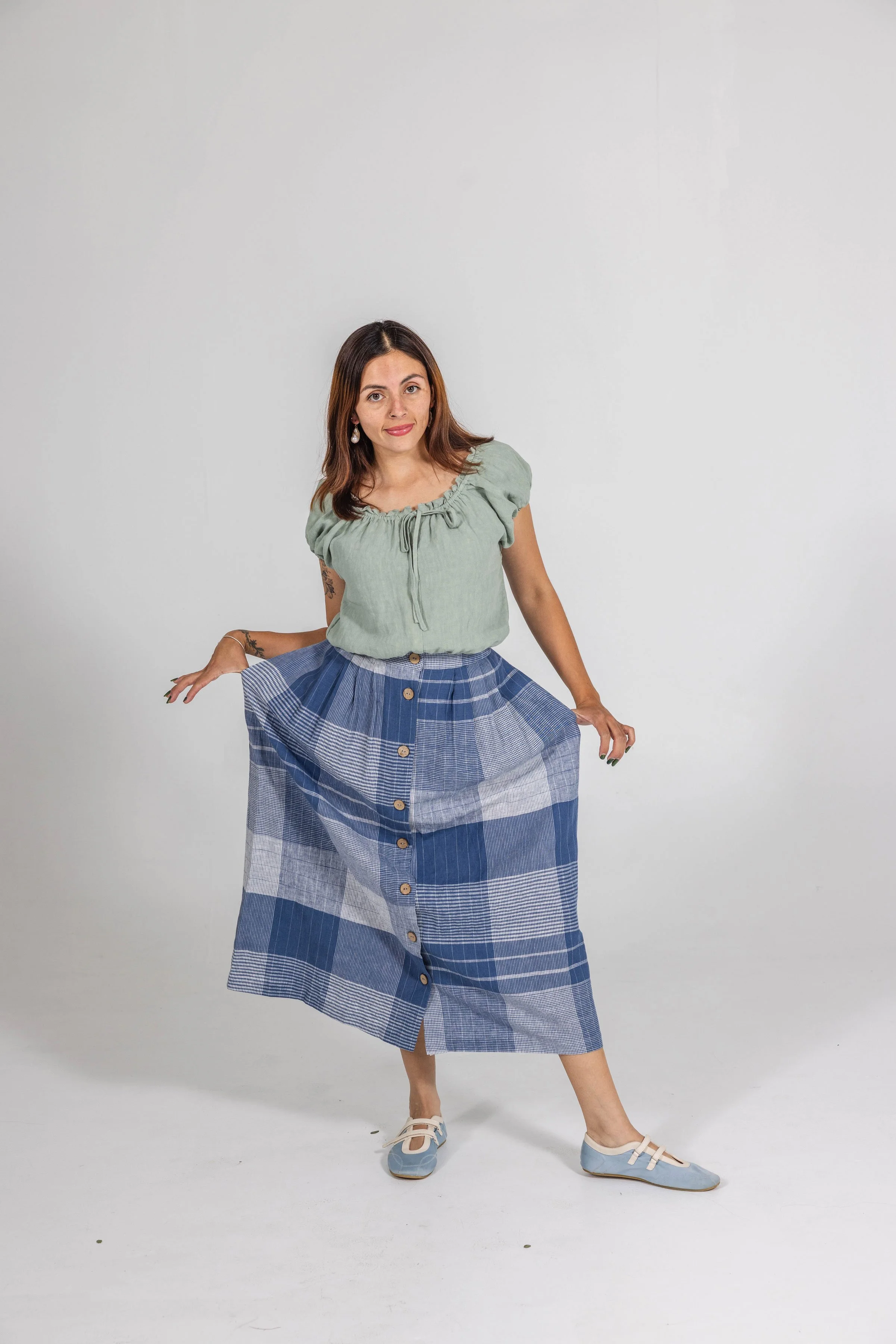 Foxlilie-womens-thomas-skirt-cornflower-plaid-lifestyle-playful-front.jpg