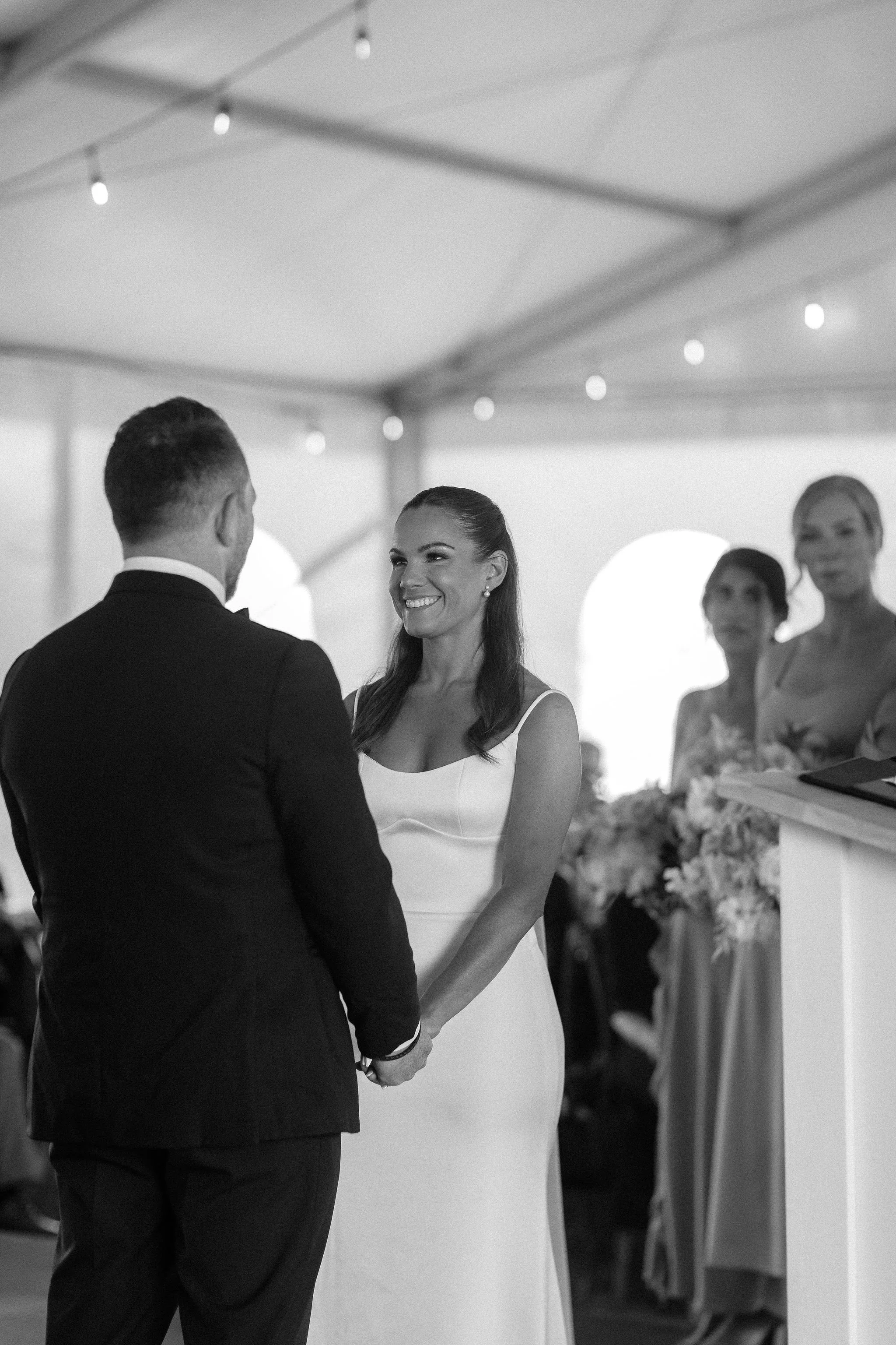 A wedding ceremony inside a large white tent, Calgary Alberta.