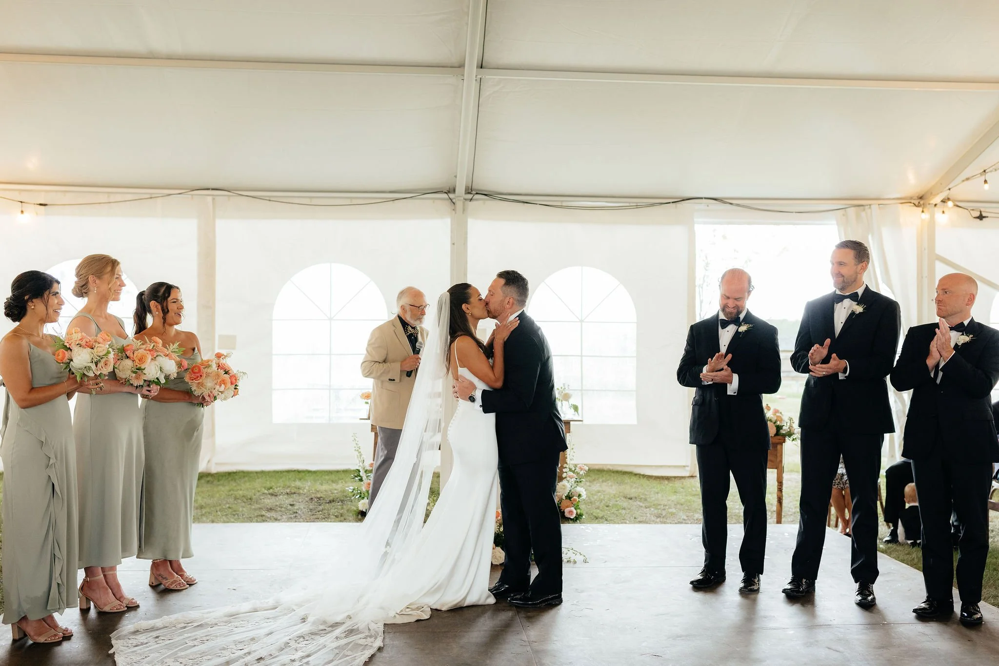 A wedding ceremony inside a large white tent, Calgary Alberta.