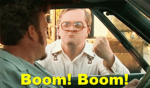 A confrontation between two men inside a car, with one man outside the vehicle making an aggressive gesture. Text overlay says "Boom! Boom!"