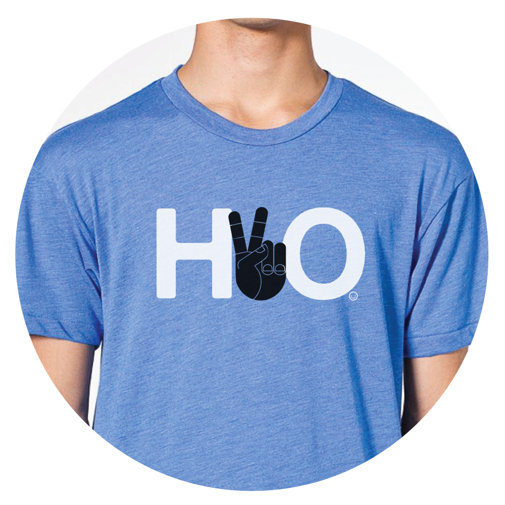 Blue T-shirt with white letters 'H' and 'O', with a black hand making a peace sign in place of the letter 'V'.