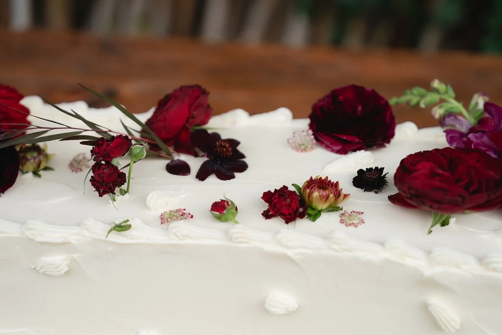 custom white wedding cake with roses