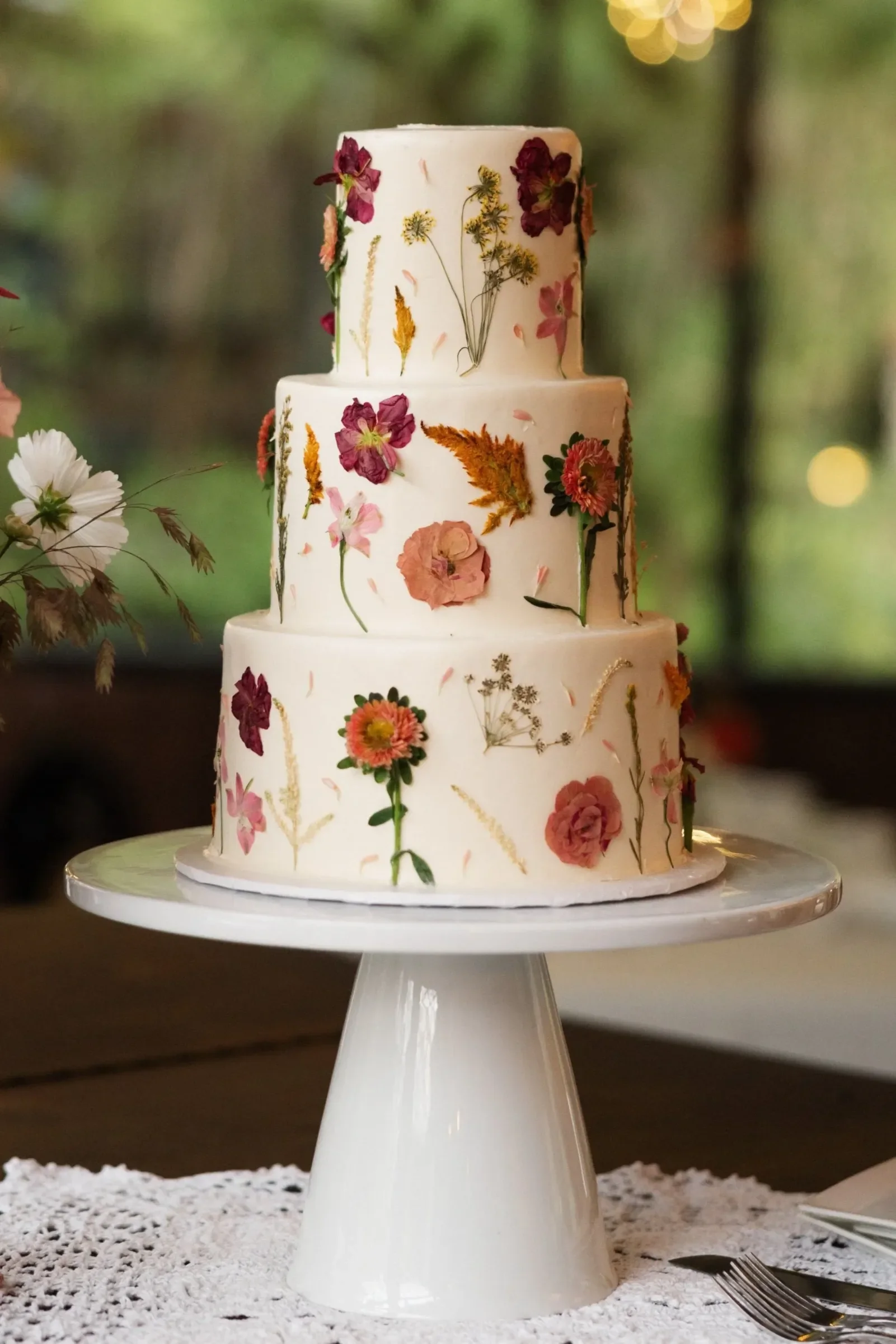 San Francisco floral wedding cake on a stand