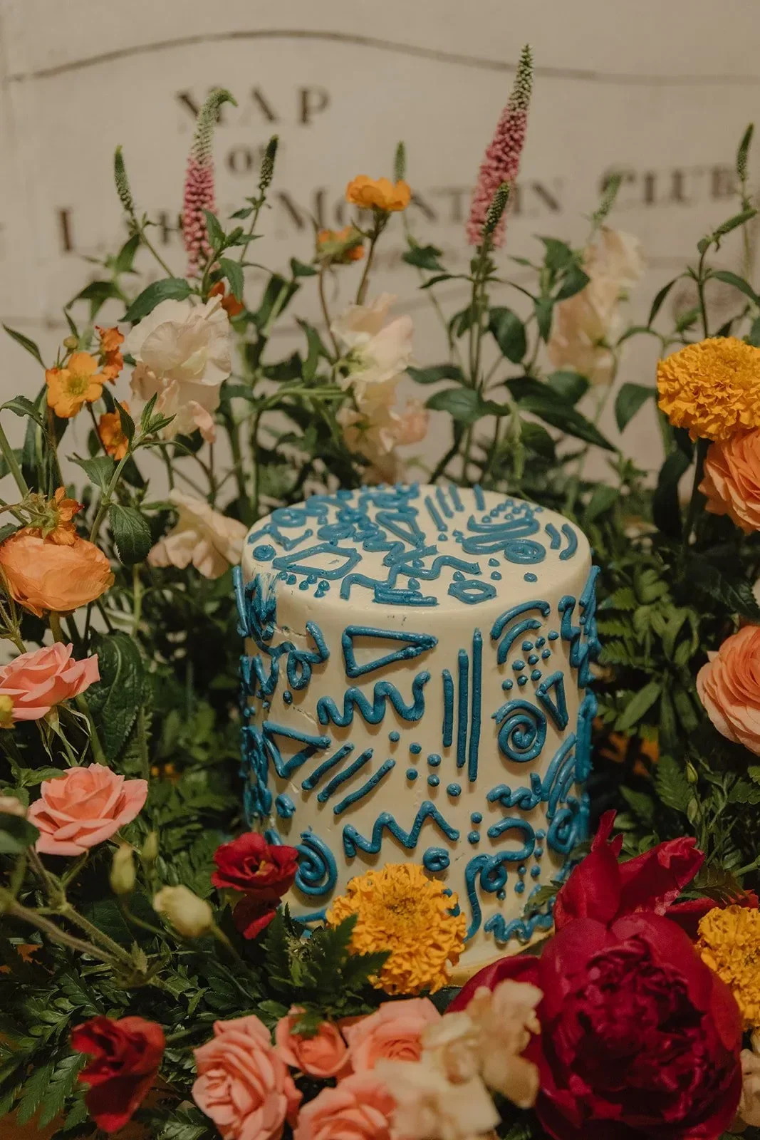 Custom vanilla birthday cake with blue squiggles