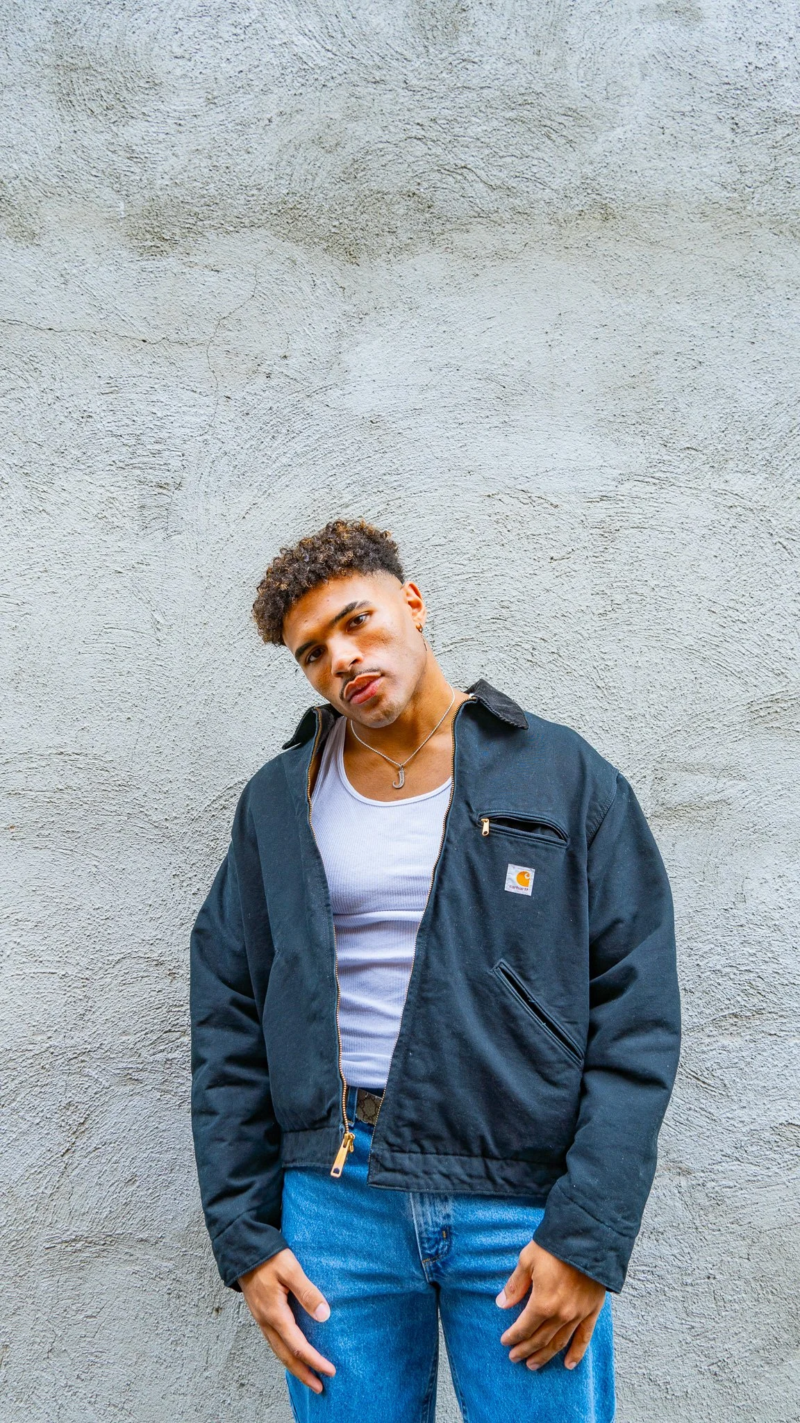 prospective model posing in alleyway