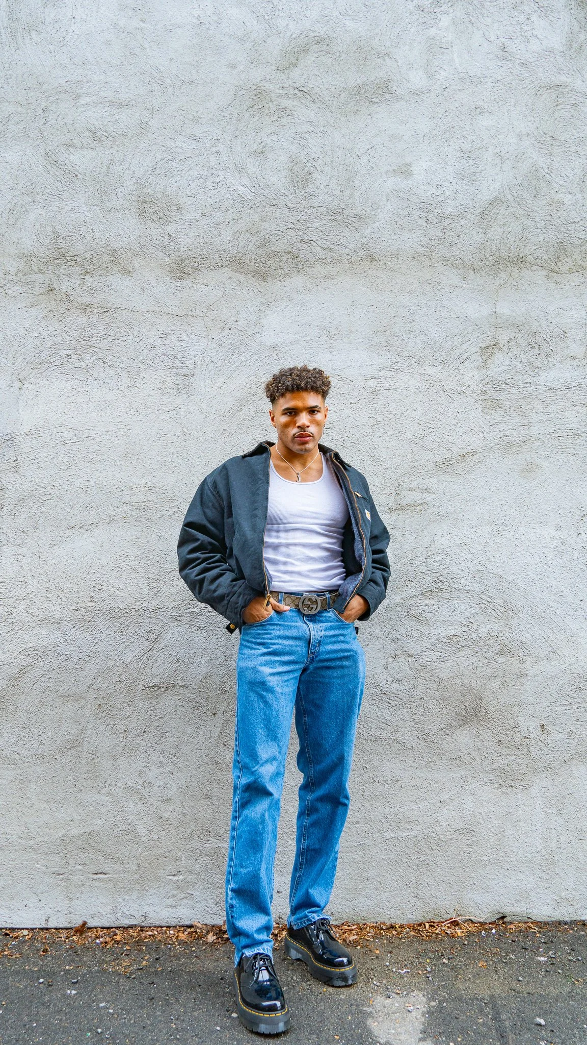 prospective model posing in alleyway