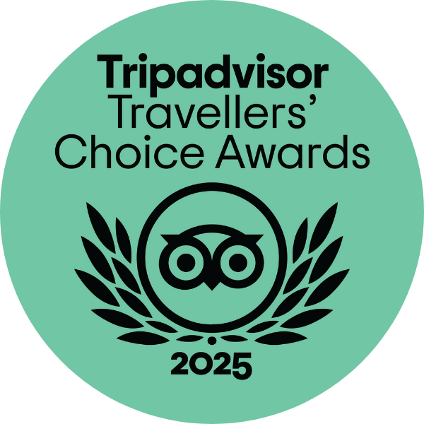 A circular logo for the 2025 TripAdvisor Travelers' Choice Awards, featuring an owl icon surrounded by laurel branches, on a teal background.