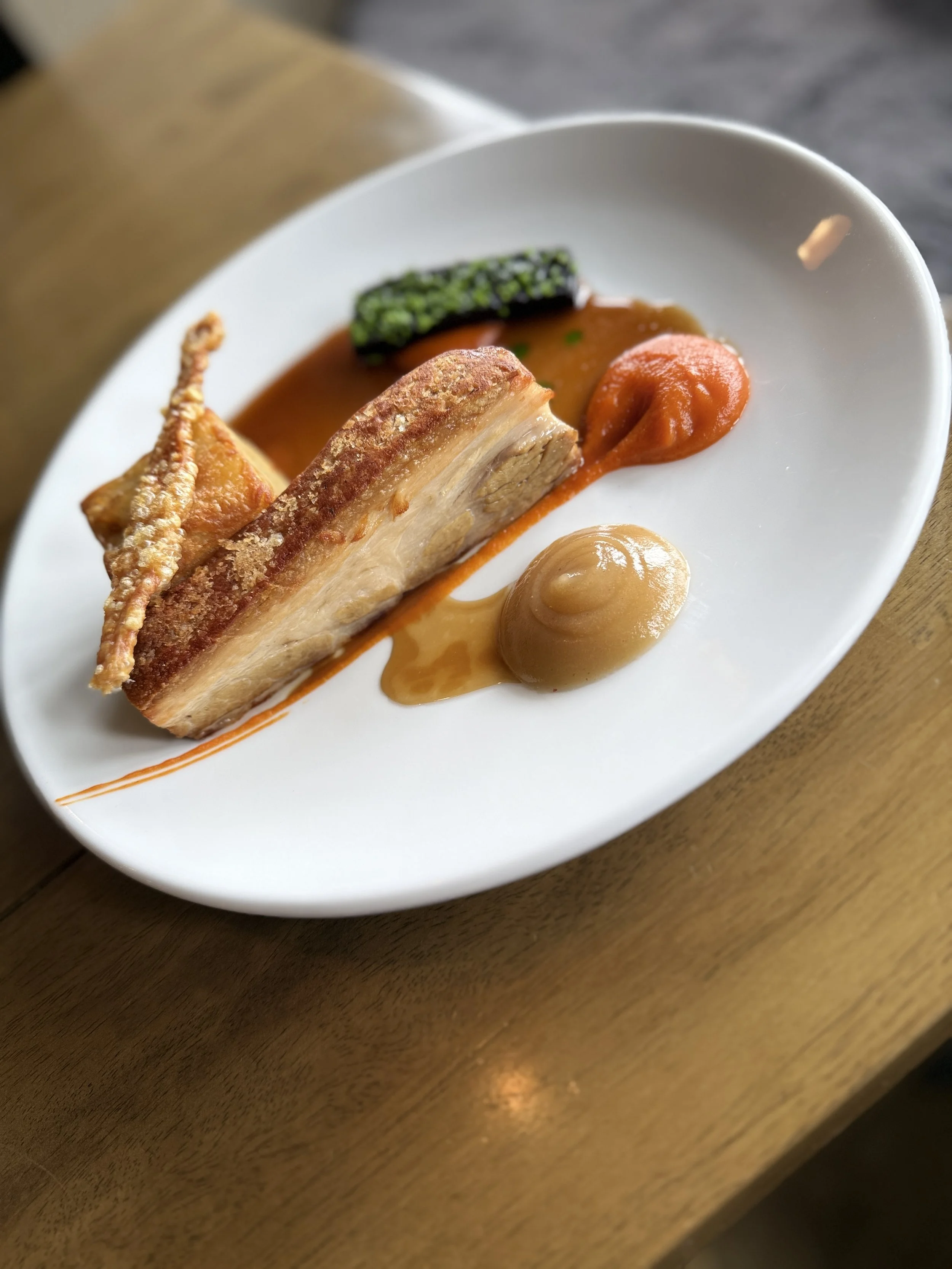 Slow cooked, free range pork belly, with carrots and a burnt apple purée