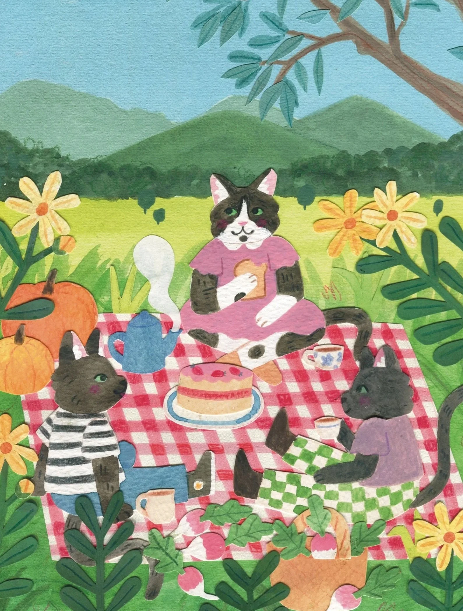 three cats having a picnic on a red checkered blanket outdoors. The background shows green mountains and trees, with pumpkins and flowers around. One cat is sitting on the blanket, another is sitting up and wearing a striped shirt, and the third is eating toast. There is a birthday cake, teapot, teacup, and a slice of pumpkin on the blanket.