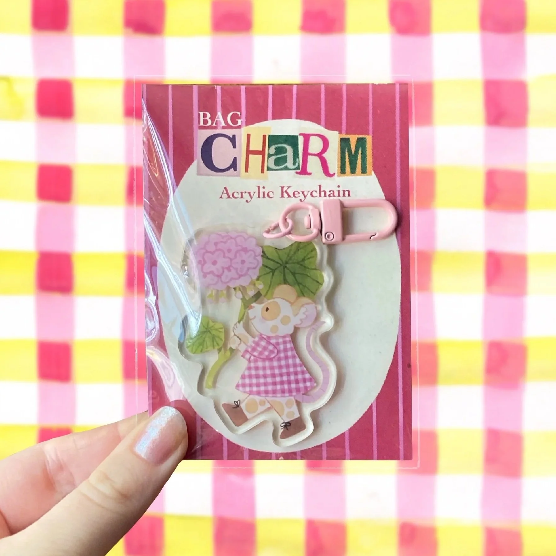 Mouse holding geranium plant acrylic keychain