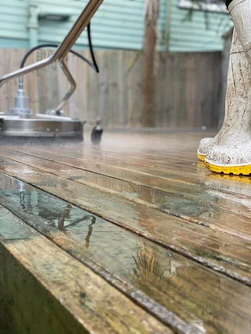 Deck being washed by a maintenance technician from DCW Services in Birkenhead