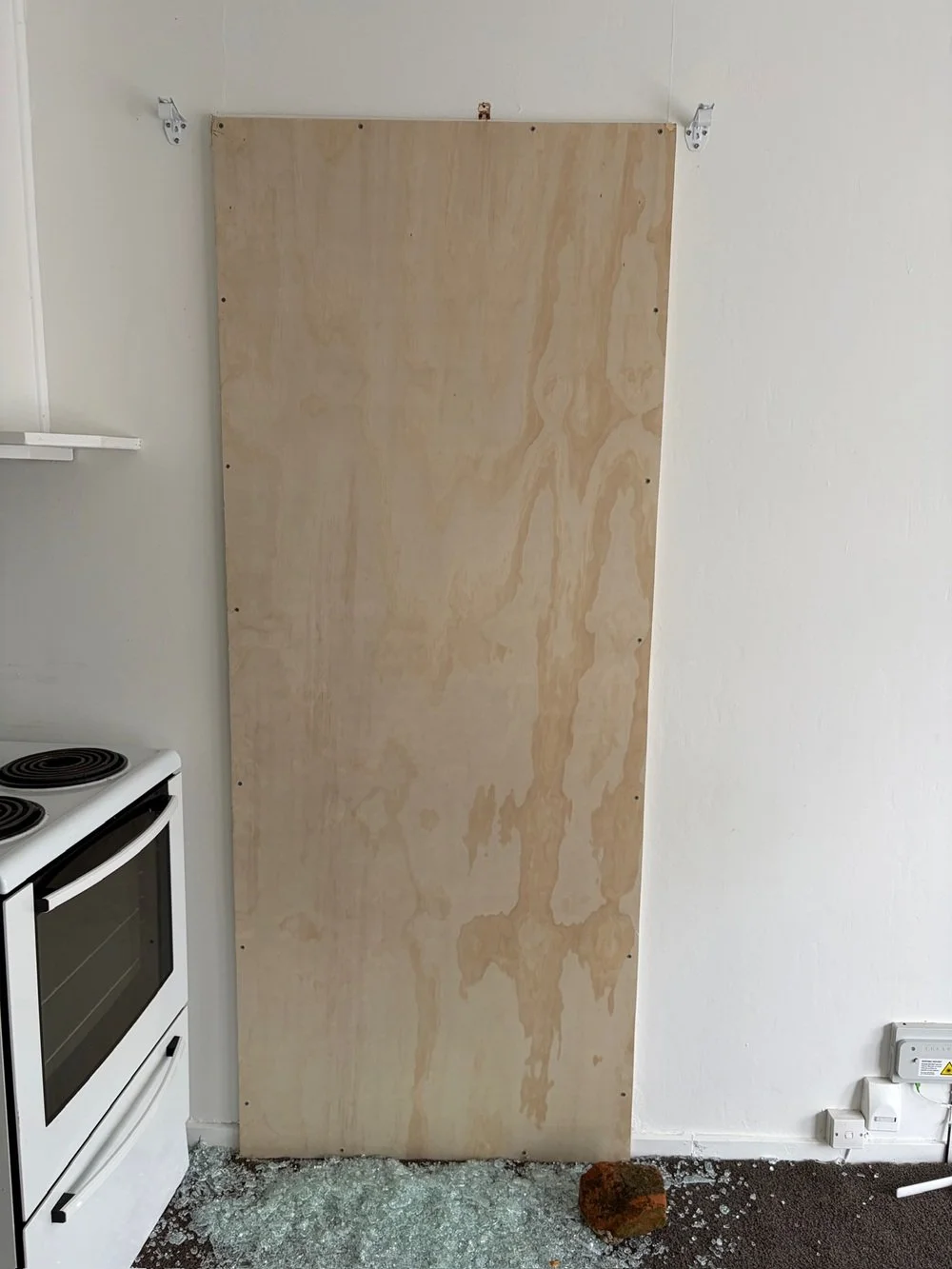 Broken glass boarded up to secure property in South Auckland