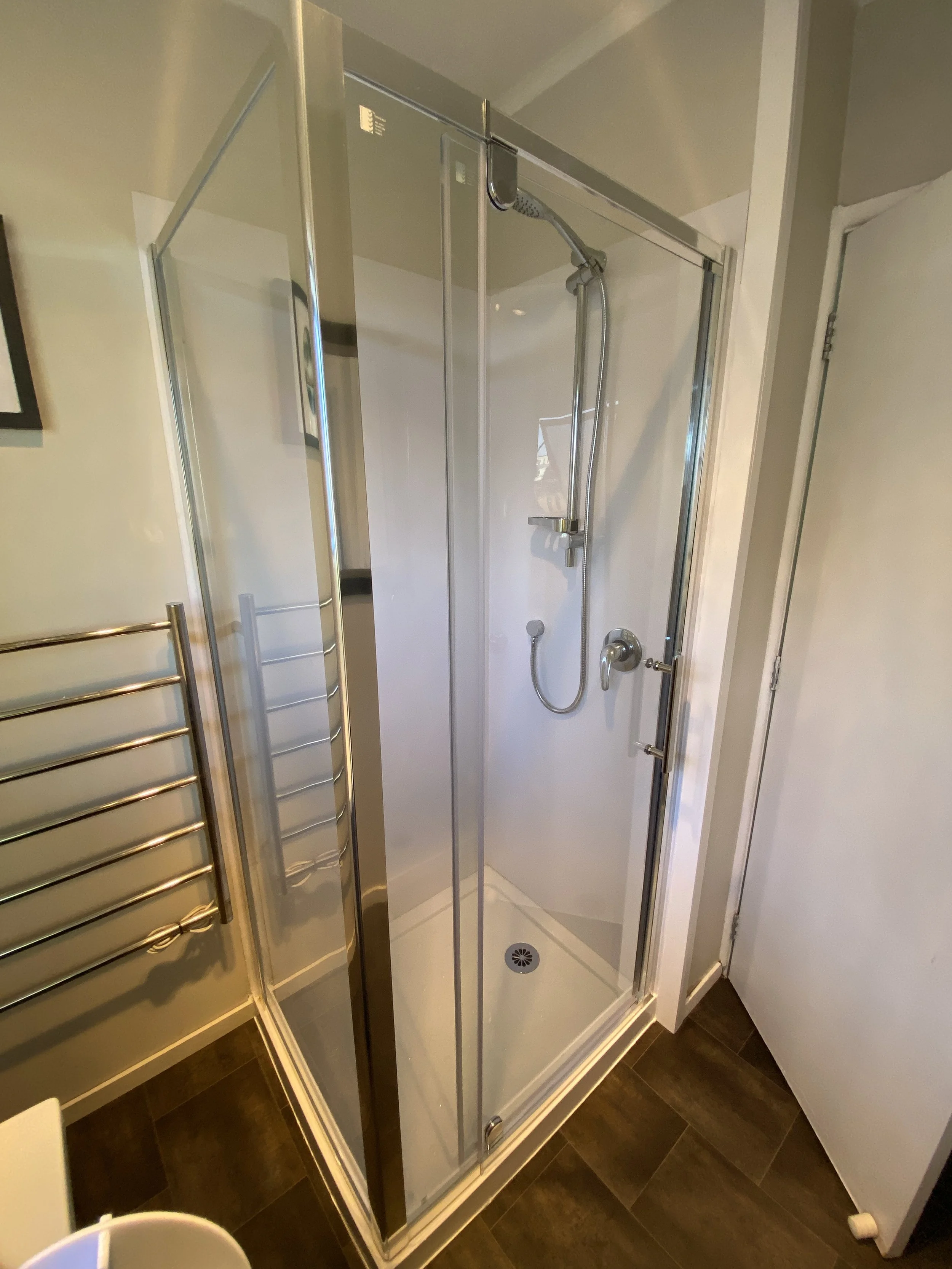 Flooring repair and shower replacement following leak damage in Auckland