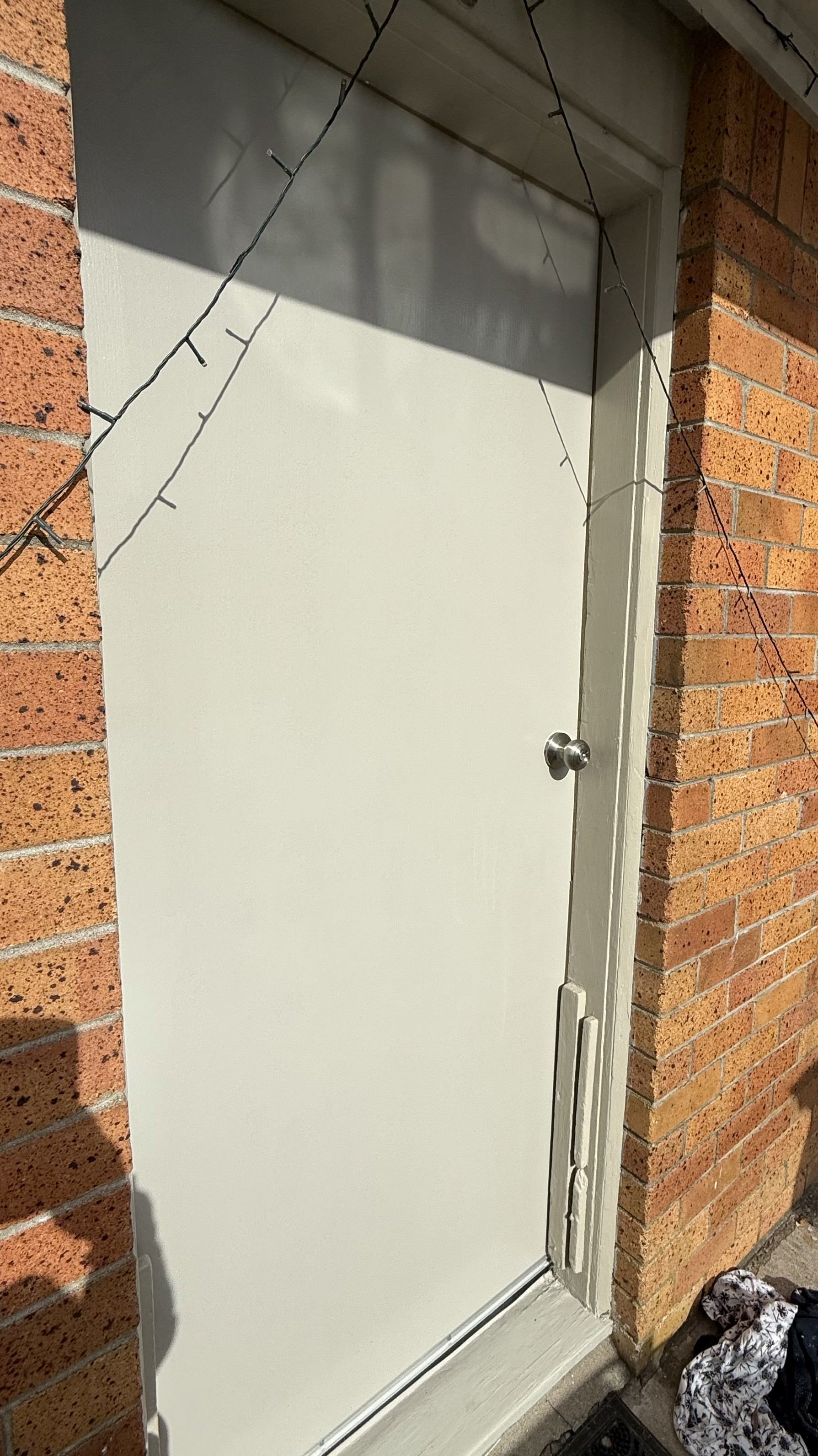 Entrance door replacement completed at tenanted property in South Auckland