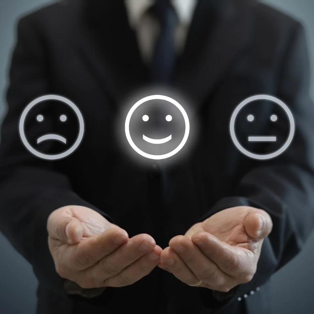 close up of hands together with 3 face icons hovering above for the Customer Service Specialist apprenticeship