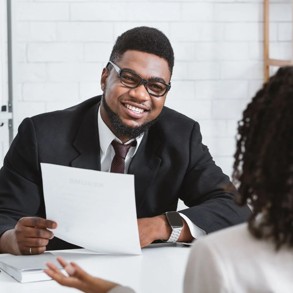 A business man on a recruiter apprenticeship interviewing a female candidate