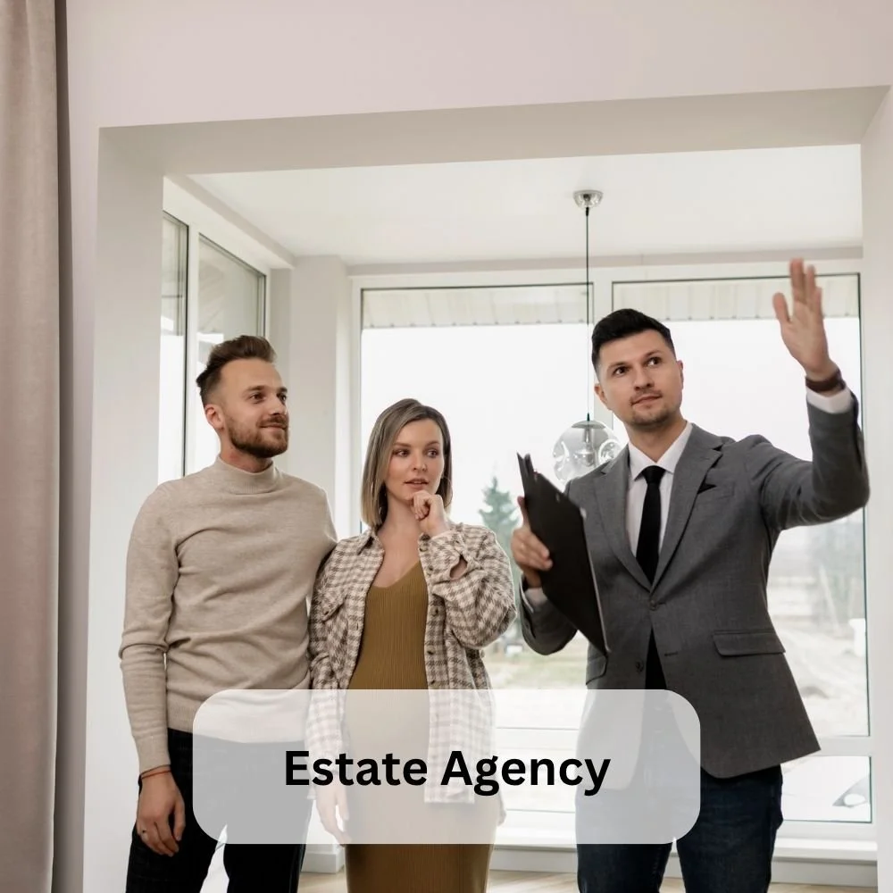 A Junior estate agent showing a couple a house on one of our sector-specific apprenticeships