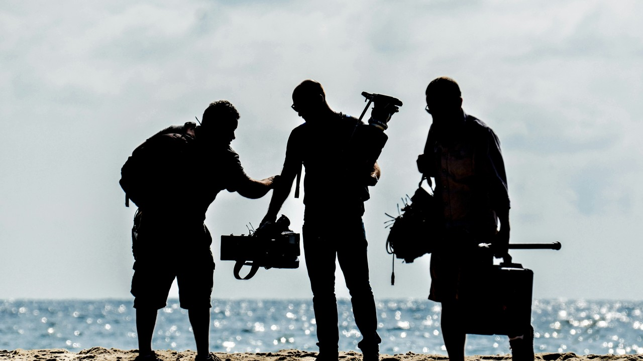 Film Crew On A Beach