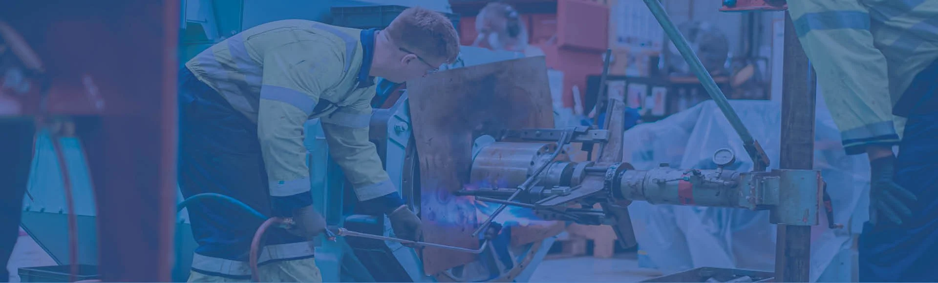 A young engineering apprentice working on a machine