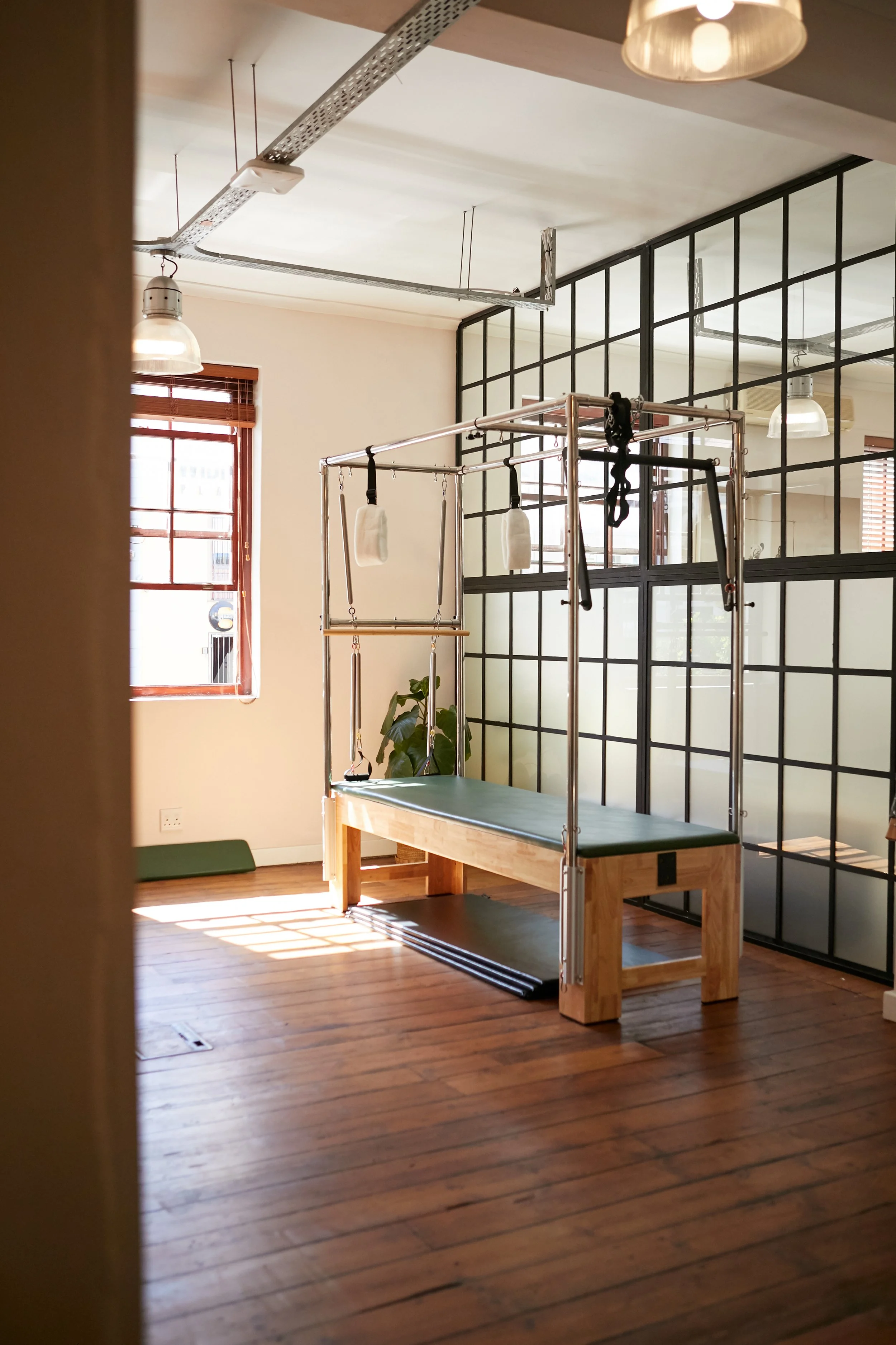 Beautiful private pilates studio with cadillac/trapeze table