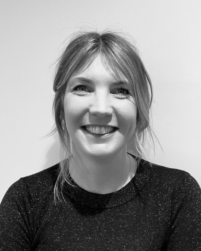 A blonde woman in a black top who is a client of Kate Nilski copywriter