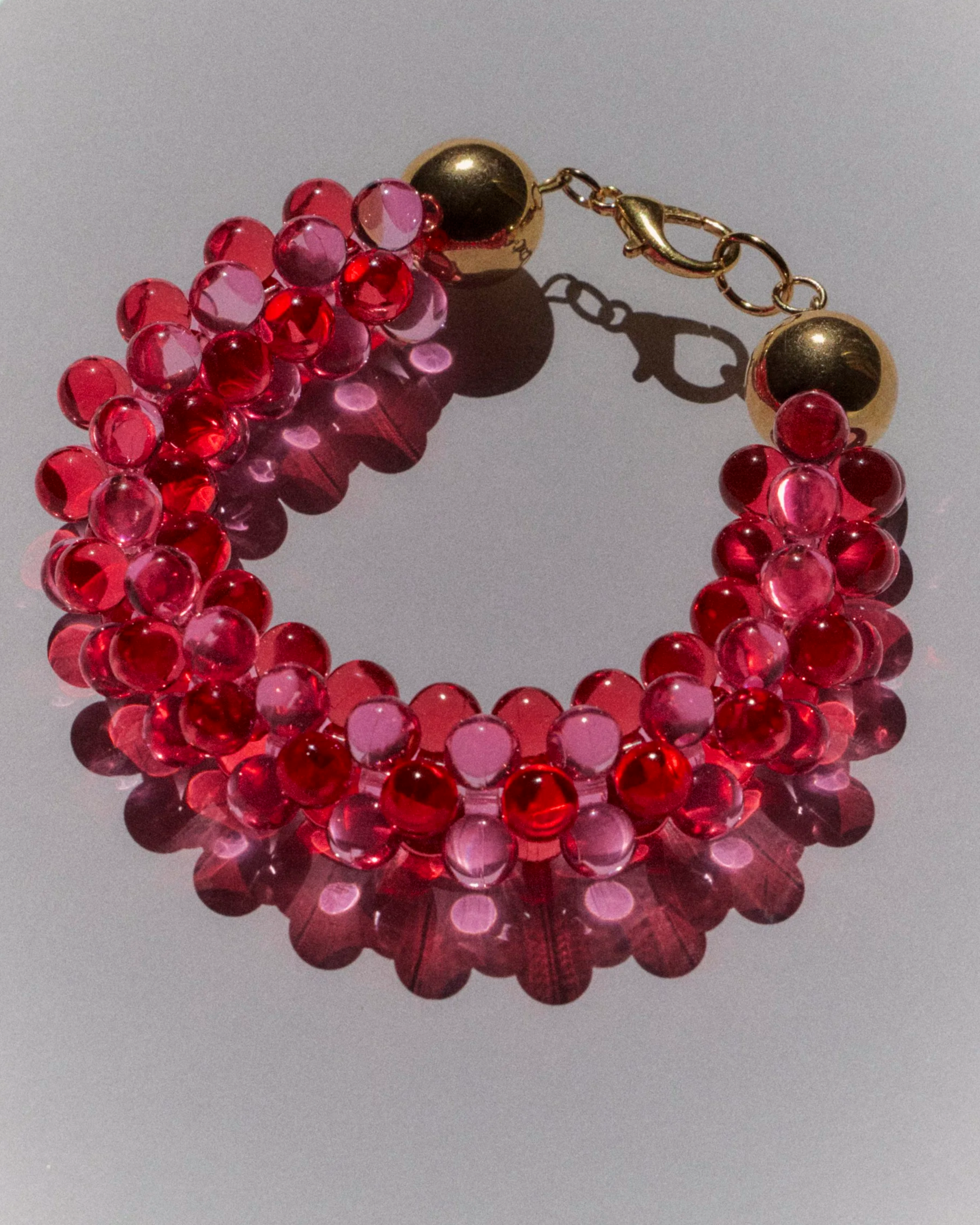 le bracelet Lys rouge/rose