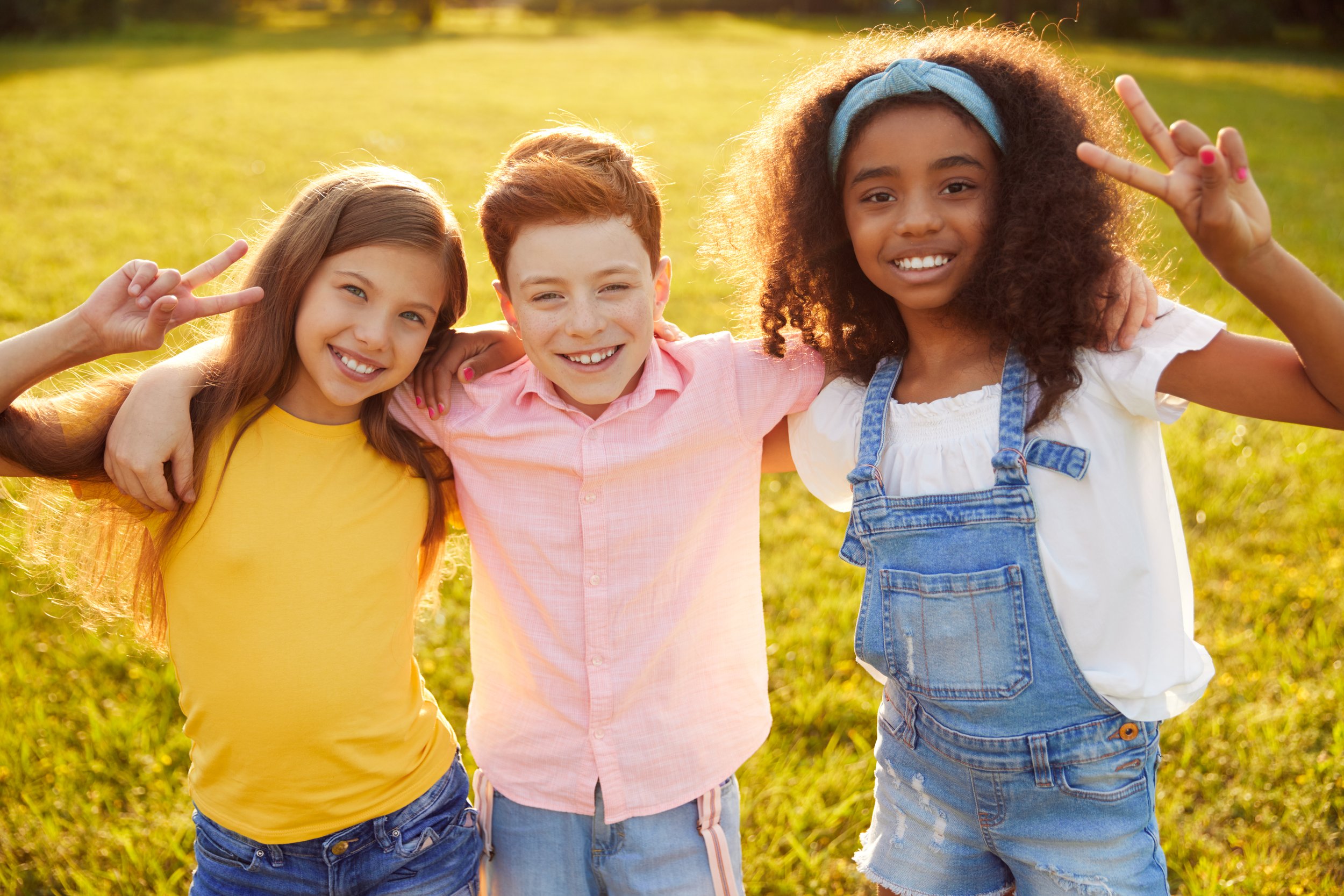 diverse-preteen-friends-embracing-in-park-2023-11-27-05-14-26-utc.jpeg
