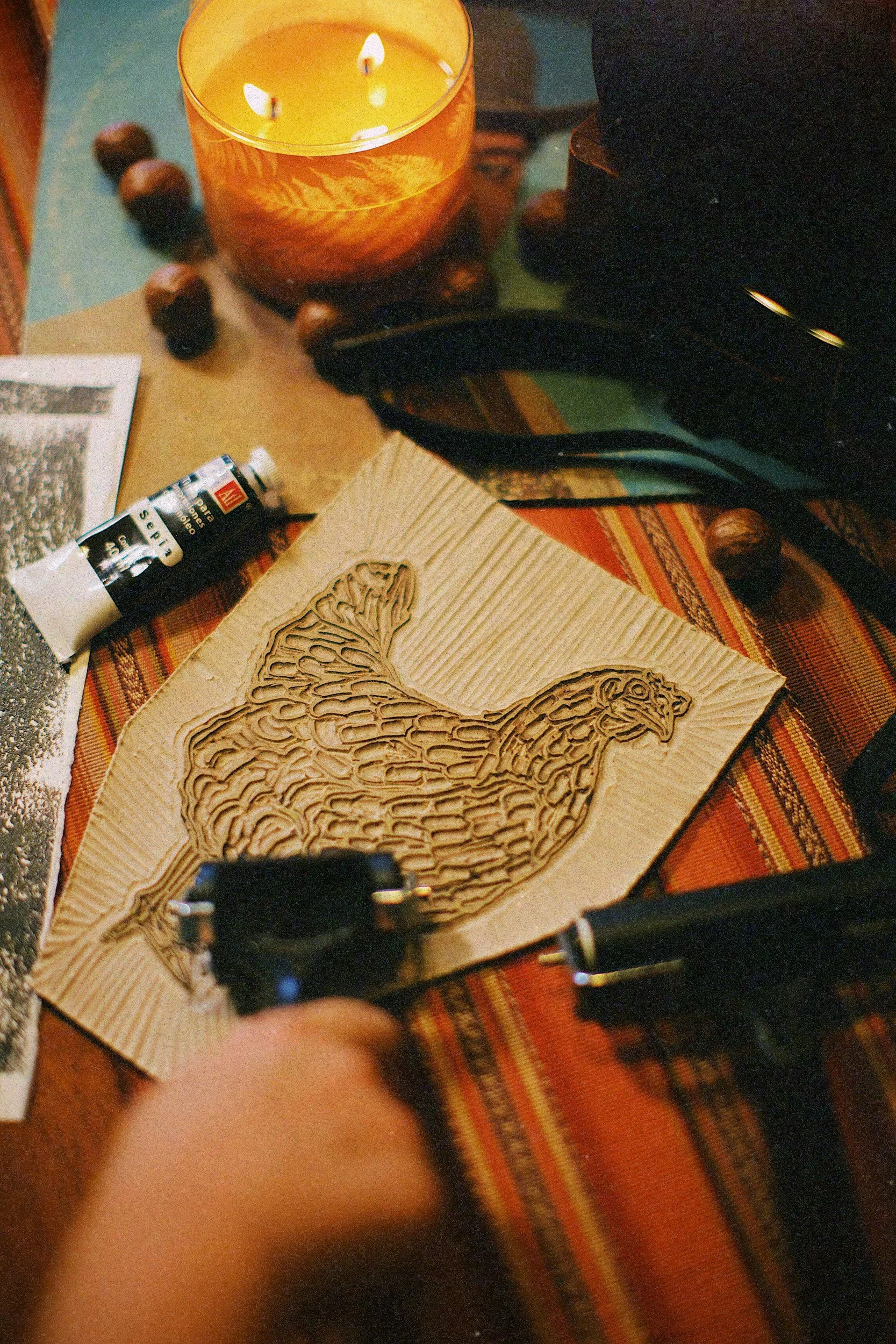 Carved stamped image of a rooster