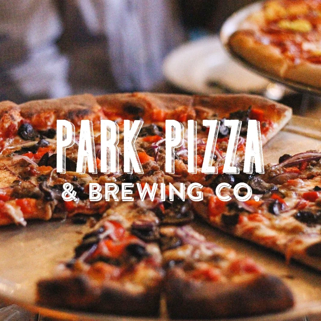 Close-up of a pizza with toppings, labeled "Park Pizza & Brewing Co." in white text overlay.