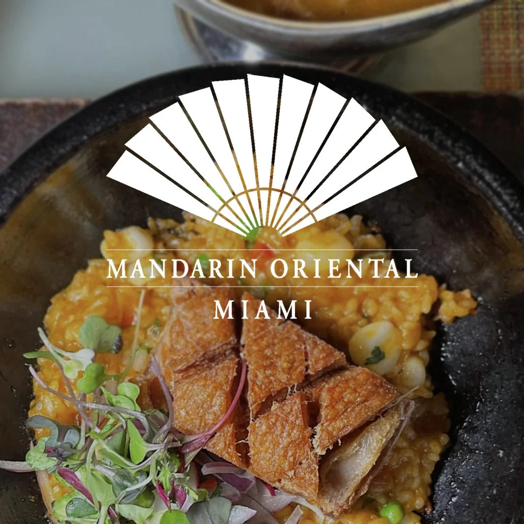 Gourmet dish with crispy duck, microgreens, and grains at Mandarin Oriental Miami restaurant.