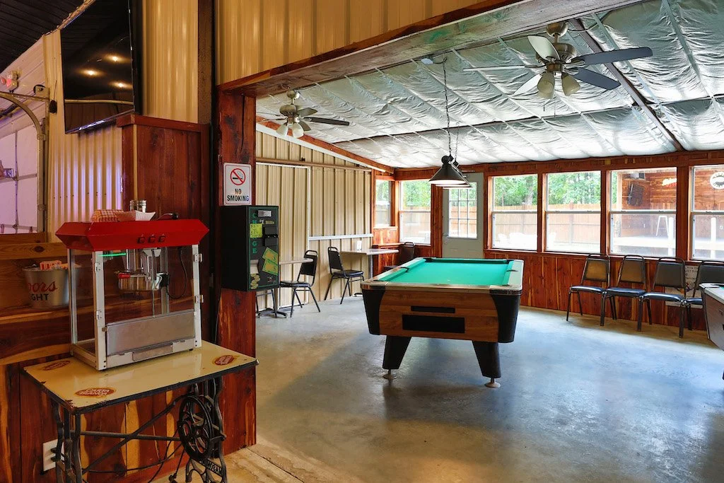 Popcorn machine and pool tables inside Lakeside Bar and Grill in Sawyer, OK