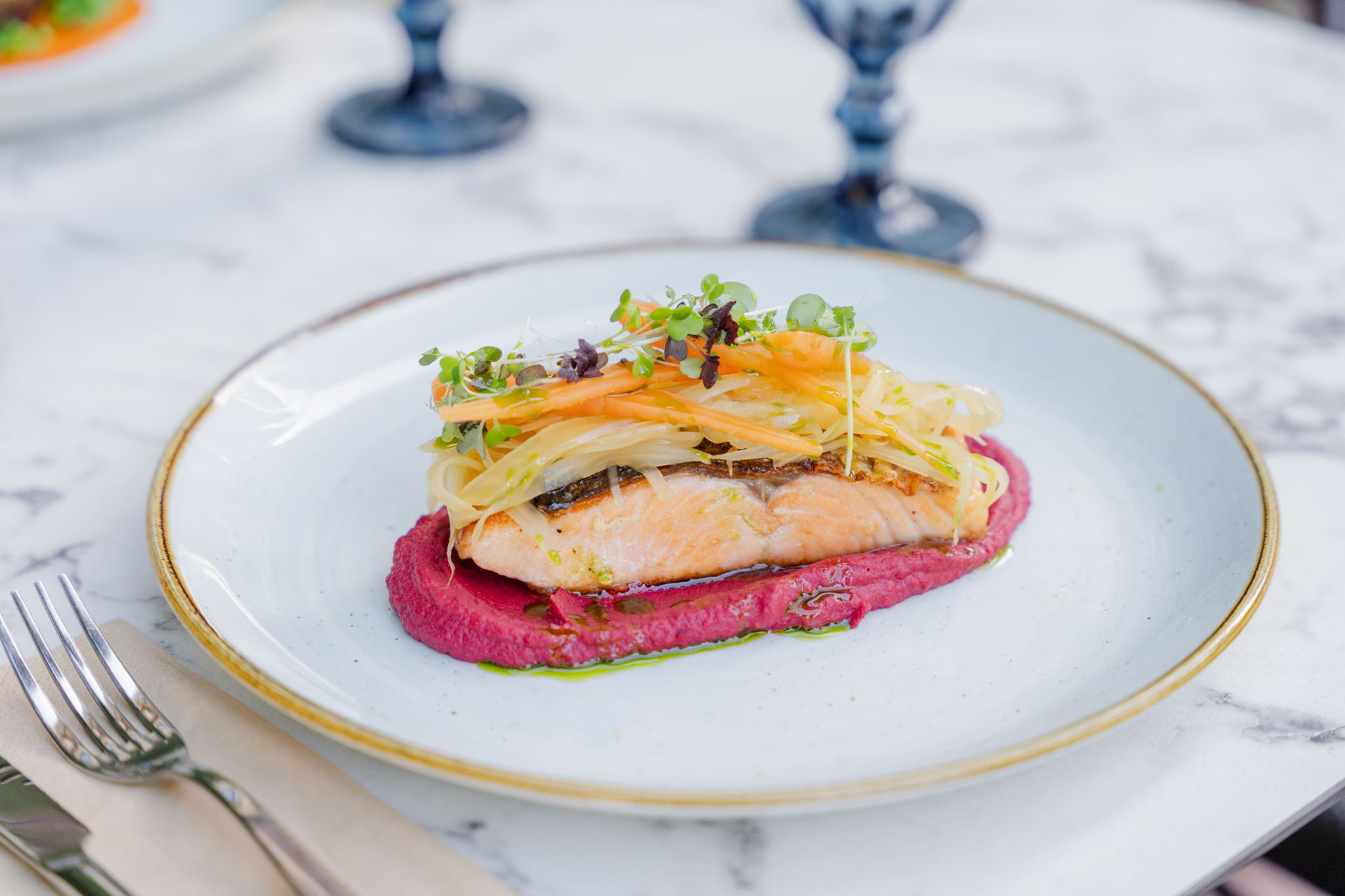 Grilled salmon with light, beetroot hummus, orange fennel salad and fermented baby carrots