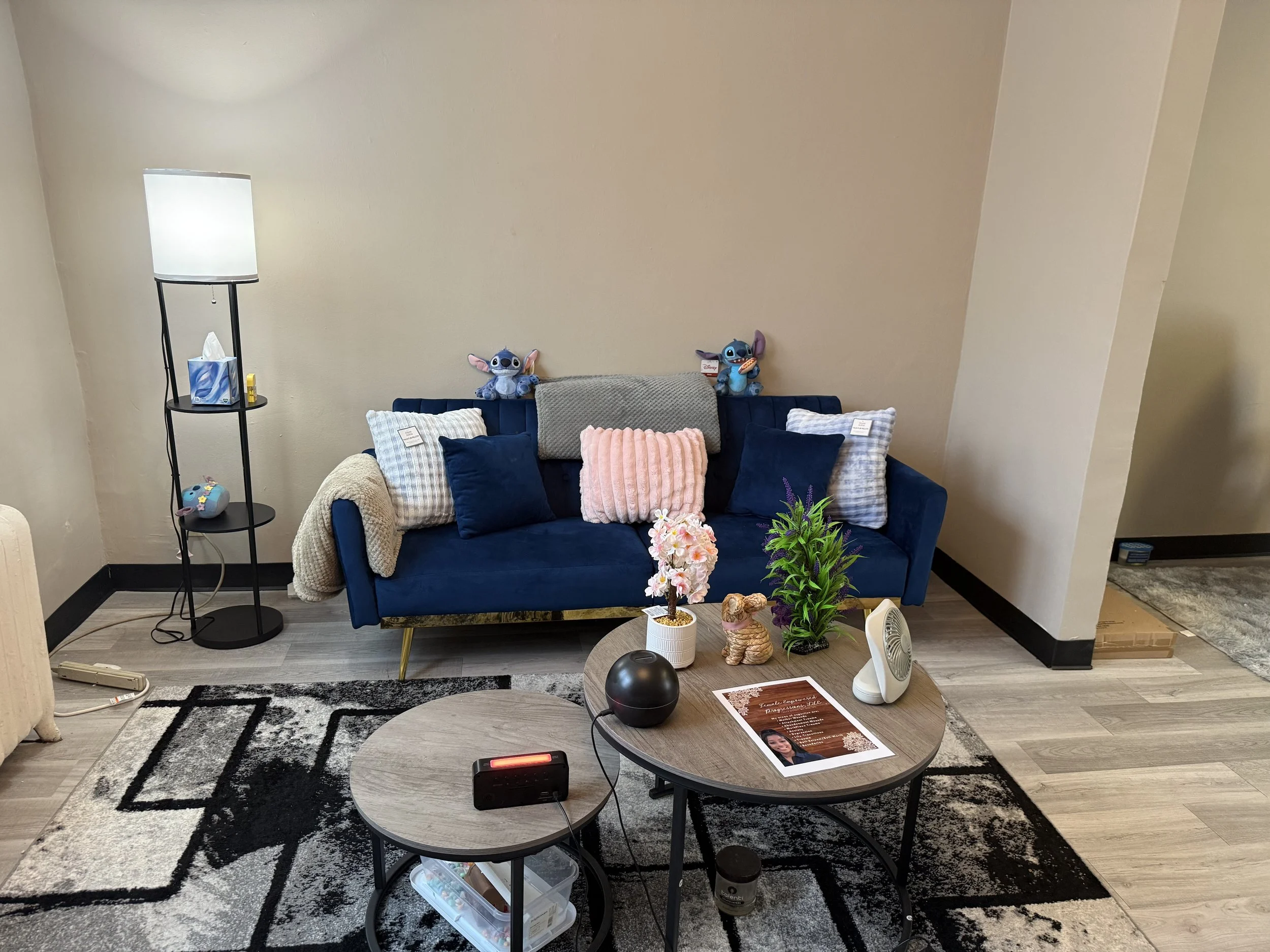 Private therapy office designed for trauma therapy, EMDR, anxiety, and mental health counseling, featuring comfortable seating, warm décor, calming colors, and a welcoming atmosphere.