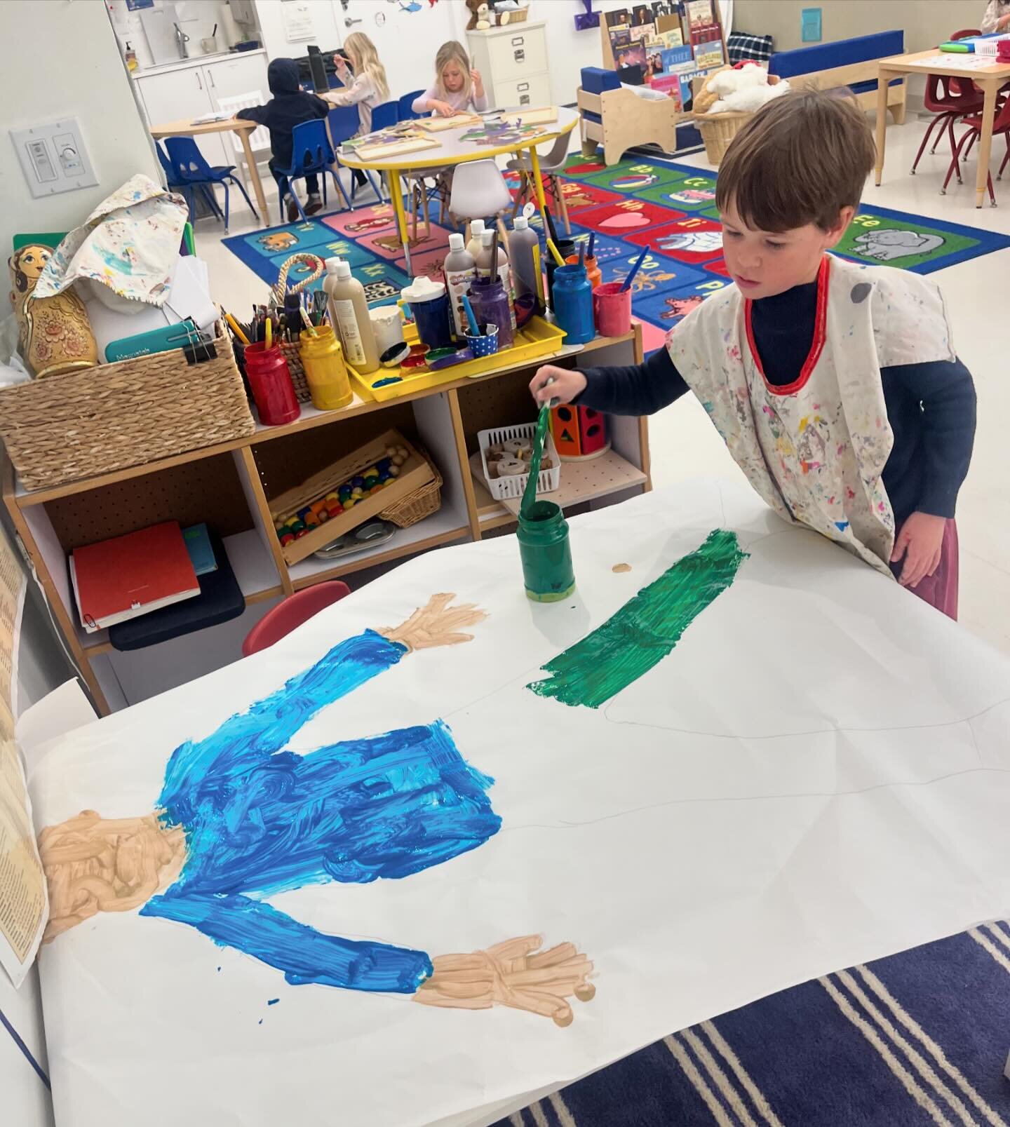 Every year the Pre-K class works on a special project simply known as &ldquo;the bodies.&rdquo; The children are traced, spend time mixing their skin tone, choose their outfit, and add any special decorations that help identify who the person is. Not