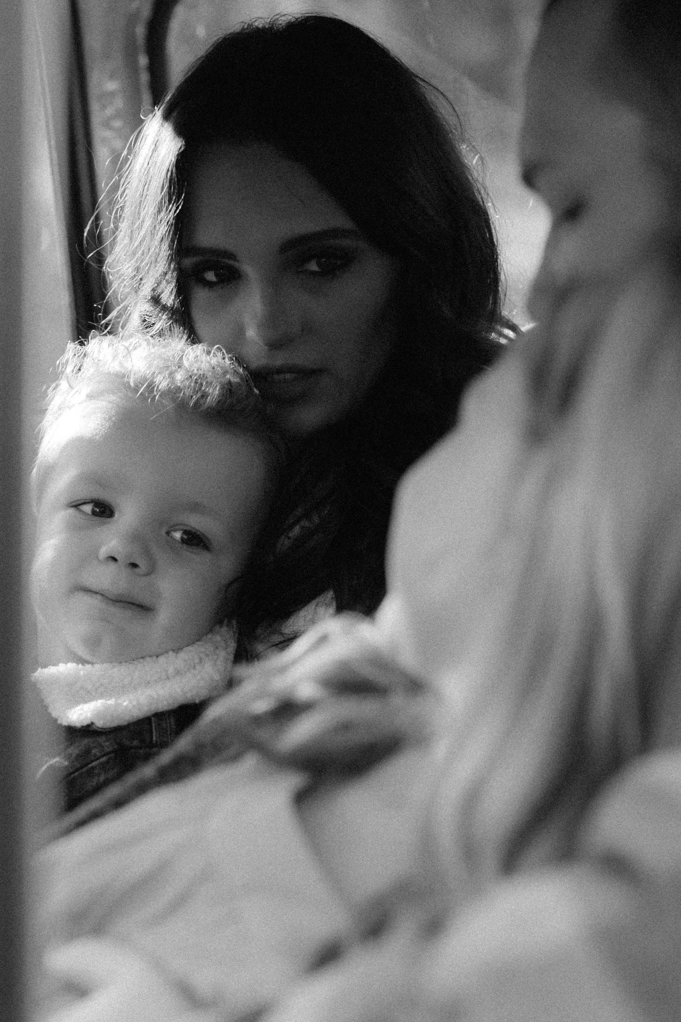 A family sitting in an old truck taking candid family photos in Oregon