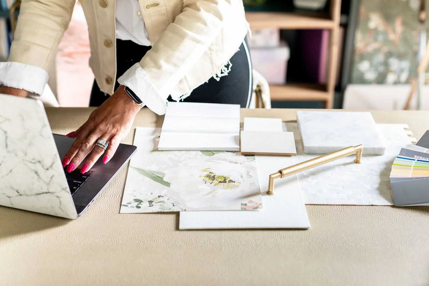 Designers collaborating over plans and swatches. Nashville interior designer studio session.