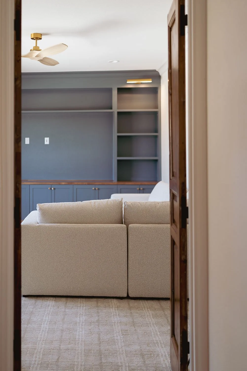 Color capping in family room using blue cabinets.