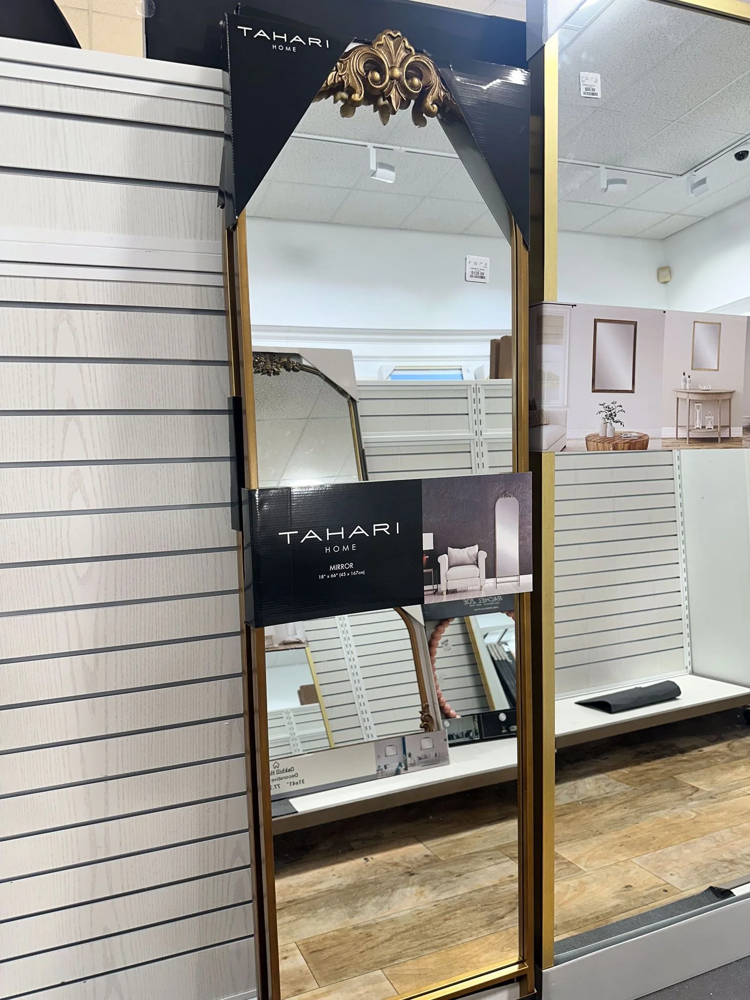 Functional dorm room decorating featuring full-length mirror and storage solutions for college dorm room essentials.