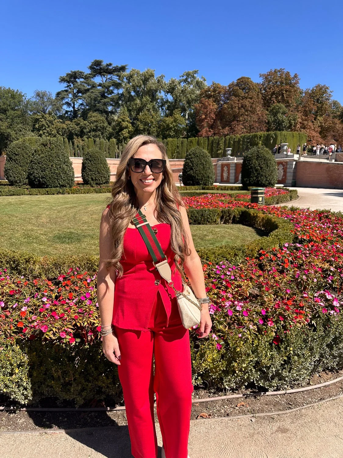 Nashville interior designer pose in garden showcasing team culture and community involvement.